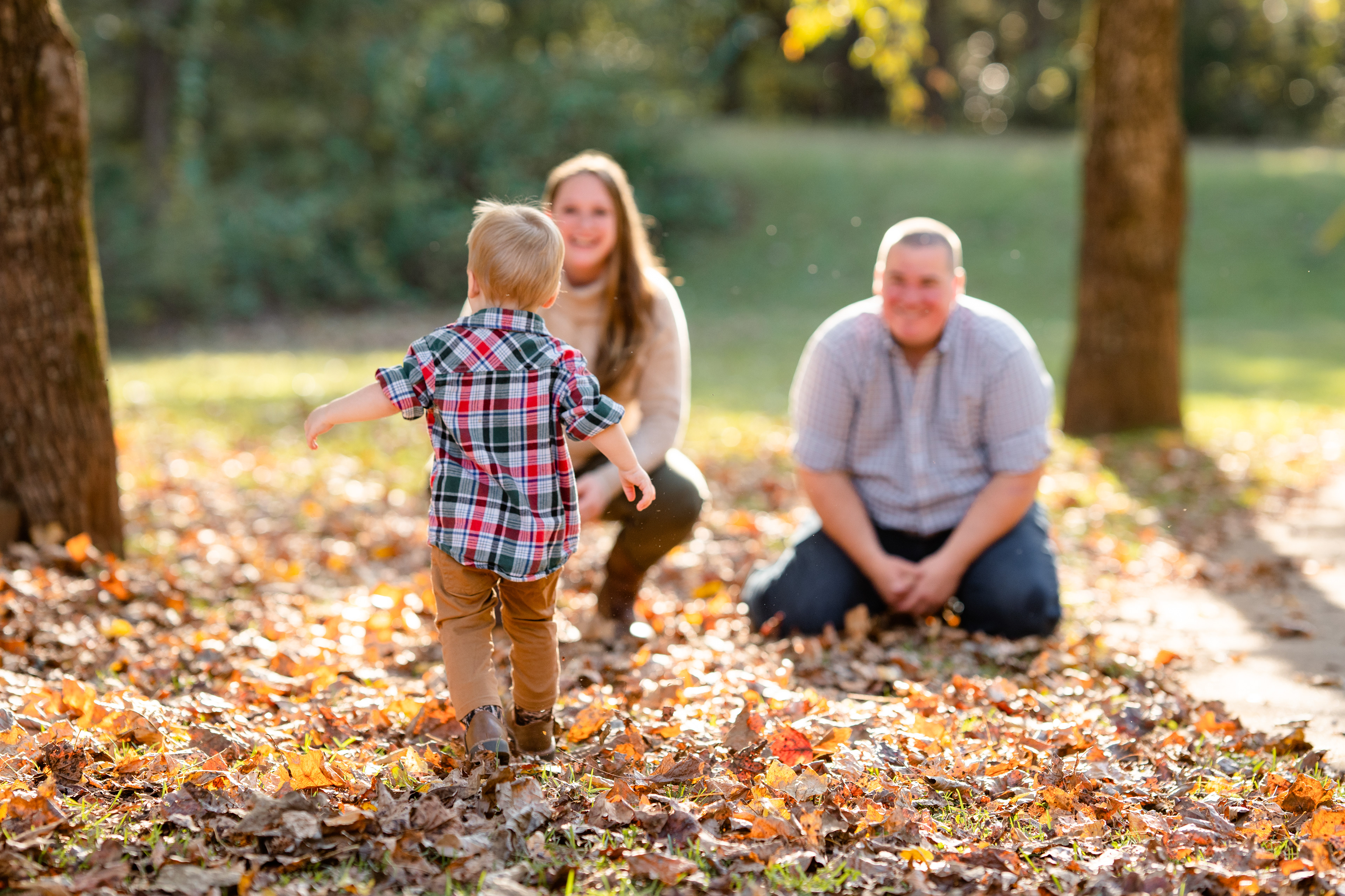 Son runs towards his parents