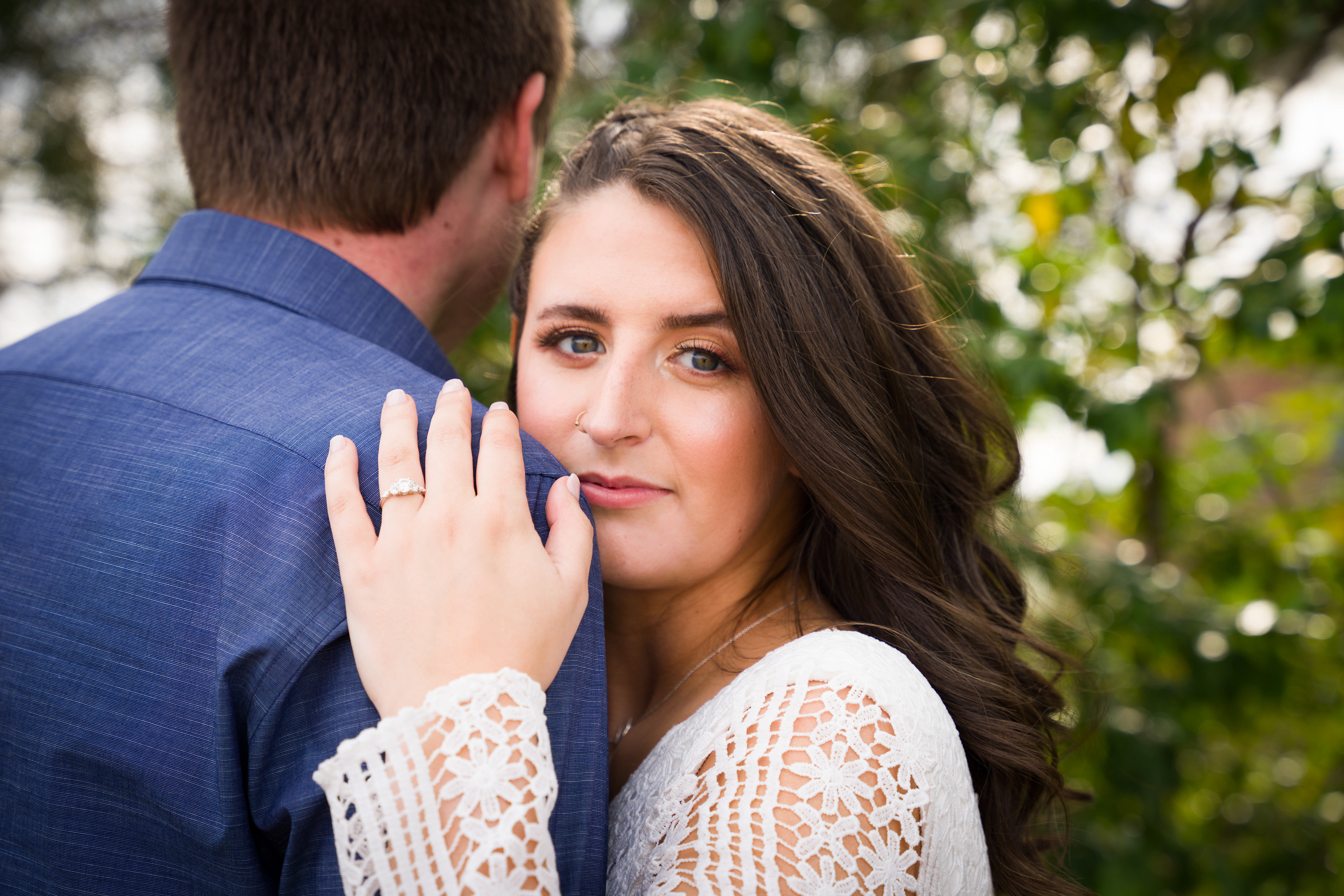 Wife holds husband's shoulder