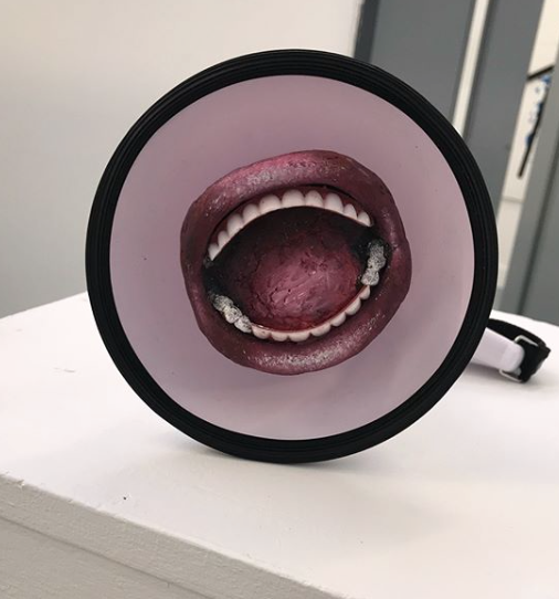 Can you hear me? Replica of mouth made my clay, painted in acrylic with plastic teeth, mouth attached by magnets onto megaphone, placed on plinth.