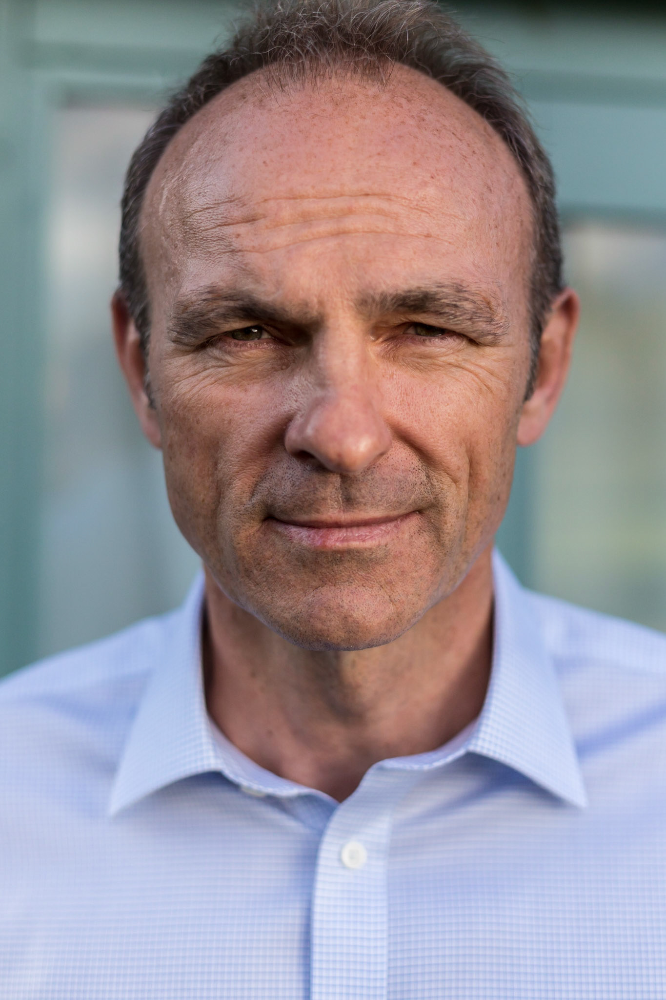 Professional headshot of a man.