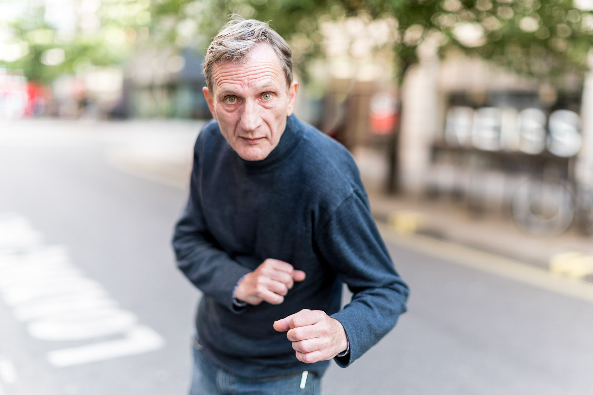 A true London character. Fellow photographer John and &amp; were peering through the window of the Getty Gallery at the back of Oxford St when out of nowhere Alfies voice piped up asking "Do you really like any of this stuff", or something along those lines.I had to admit there were a lot of images that were more reportage where their value was more to do with the record of an event or a moment in the life of a celebrity than any true beauty as a photograph. however there were also many stunningly beautiful photos which could be regarded as genuine art.Alfie started his working life as a graphic designer before computers took over, when he switched to working in the fine art world becoming a framer; providing custom frames to the worlds wealthy to display their latest art aquisition. His frustration at city boys with money but no eye coming to him with art which they didn't even know if they liked was expressed with straight forward colourful language. The final straw was when the company he worked with was bought by an investor who decided to stop using real gold leaf on frames for something cheaper and fake. I sense that Alfie is a true craftsman and proud of what he does because he quit telling them in no uncertain terms that they were a bunch of !@£$% thinking that was a good way to do things.We must have chatted for a good 20 minutes before parting company. Alfie was happy to let me take a few portraits but I quite like this one which was a bit more posed for a massively shallow depth of focus.p.s. does anyone else think he has more than a passing resemblance to a certain James Bond actor?