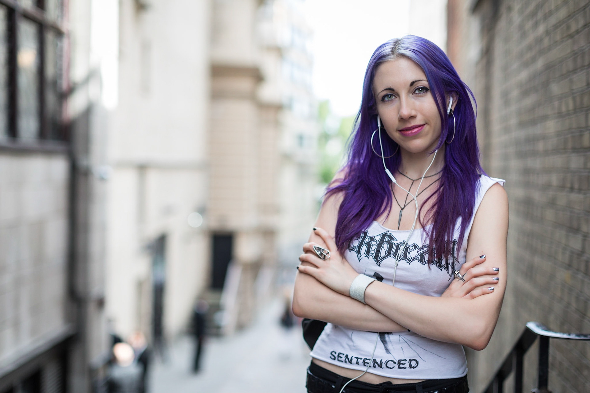 I've probably mentioned before that I like to have the occasional drink and sit down as I wander about London with my camera. It was in my most frequented sandwich bar that I first saw Andrea. I was just waiting to pay when she came to the adjacent till. I did hesitate for a moment before asking her if I could take a photo but she readily agreed so I dumped the tray of food I'd bought with fellow photographer John and grabbed my camera.The interior of sandwich bars can have nice stylish decor for blurry back grounds but I thought it might be nicer to go outside and have some blurry London. There was an alley from the Strand down to the Thames close by which was perfect.I asked Andrea what she did and her answer was "I make knives" Wow! I don't think I've ever met a knife maker before. She is also a jeweler and artist and was in London for a few days having spent a month in Europe on an art project before heading home to Austin, Texas.  Have a look at her Facebook page https://www.facebook.com/BrainCasterWhenever I ask a stranger if I can photograph them I'm always acutely aware that they are giving their time freely to me so I try not to delay them too much with whatever they are doing. I hope in my brief time with Andrea that I managed to capture her beauty, confidence and individuality. I'll admit I would have loved to have spent more time photographing her.