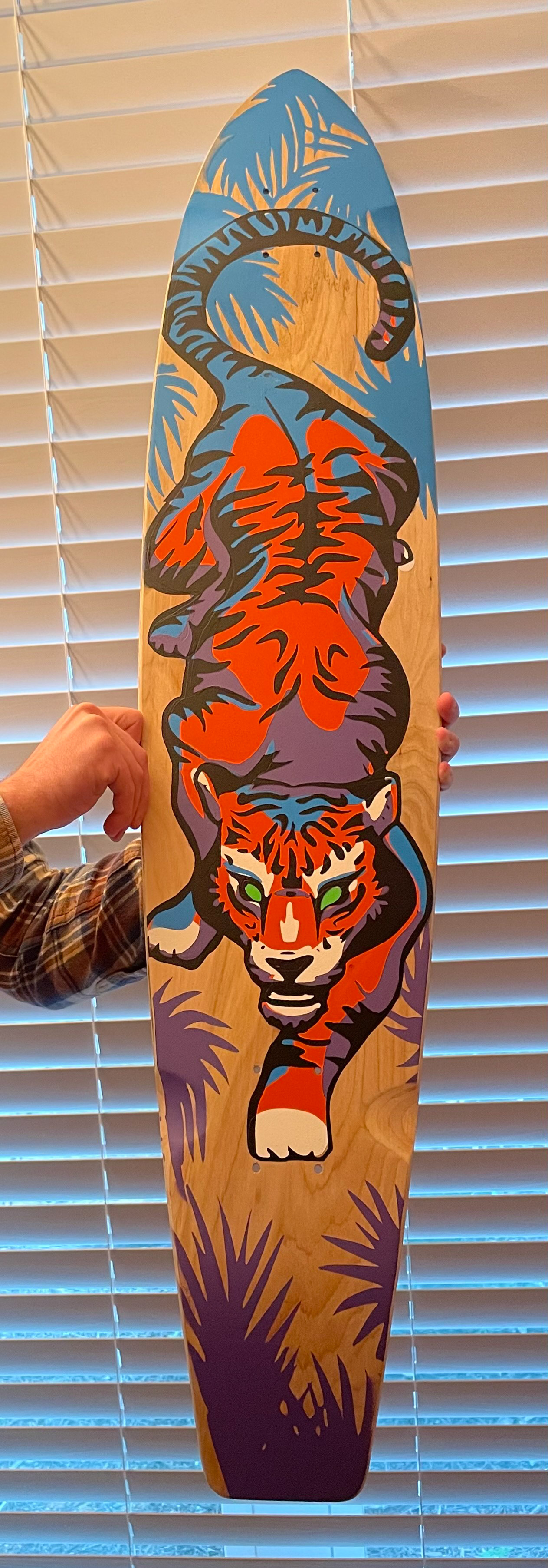 Spray painted board art by Cat Pavell