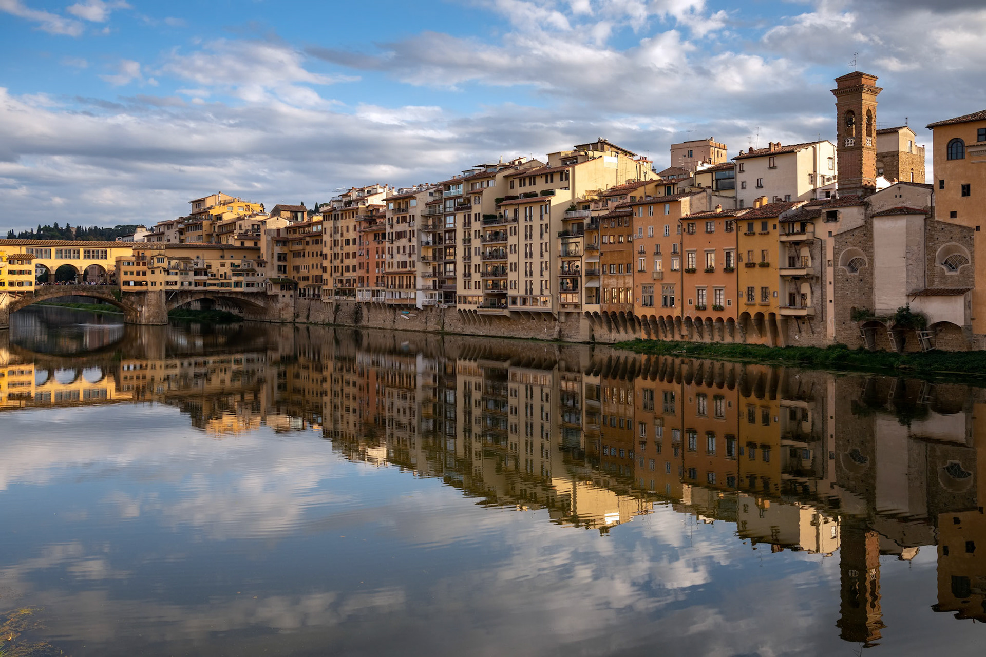 FLORENCE, TUSCANY/ITALY - OCTOBER 18 : View of buildings along and across the River Arno in Florence  on October 18, 2019. Unidentified people.