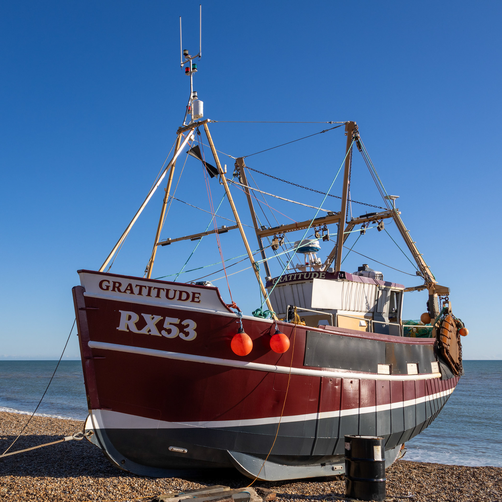 Hastings, East Sussex, UK - February 12. View of a fishing boat on the beach at Hastings, East Sussex on February 12, 2024