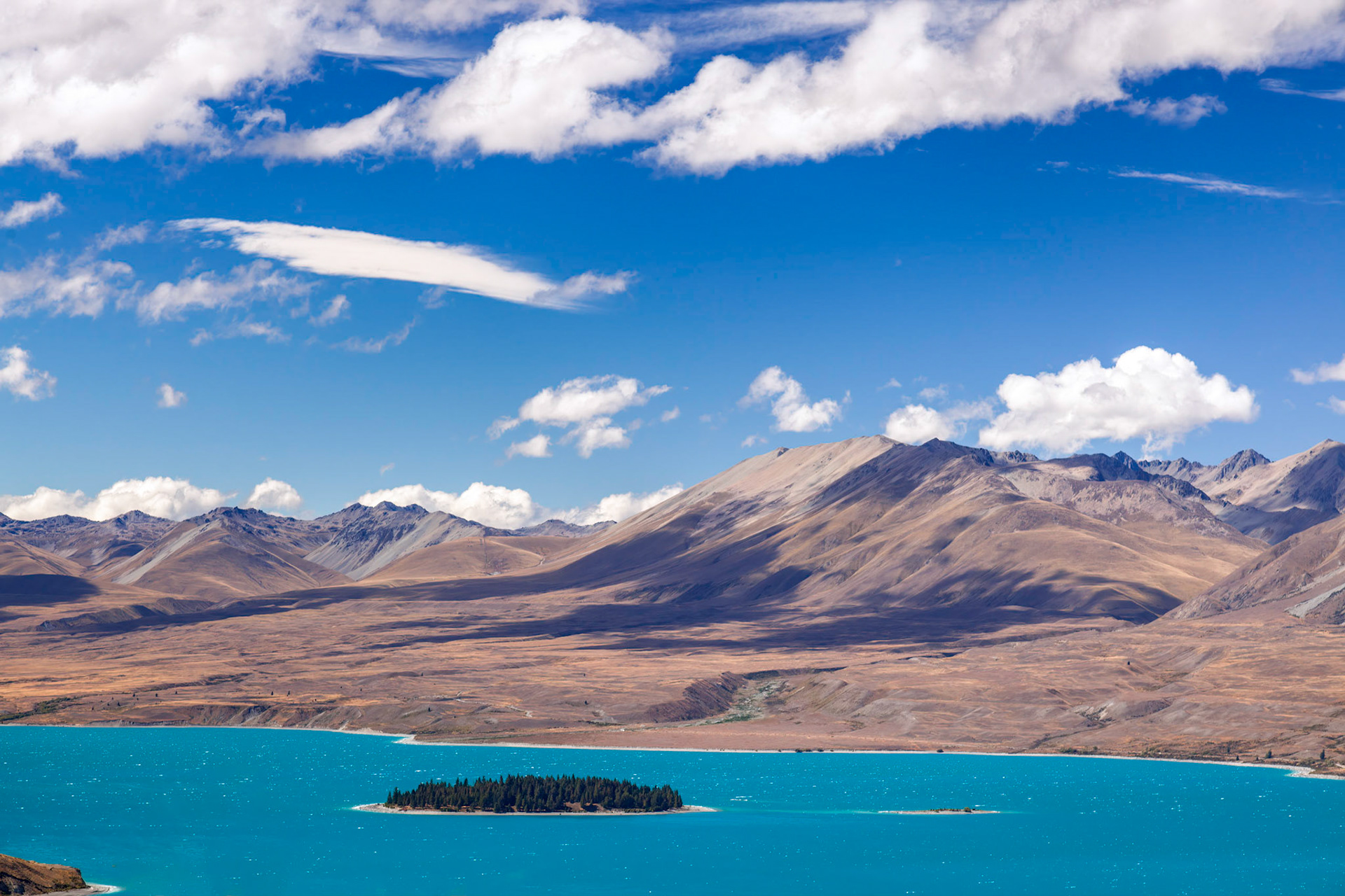 Scenic view of Motuariki Island in the colourful Lake Tekapo