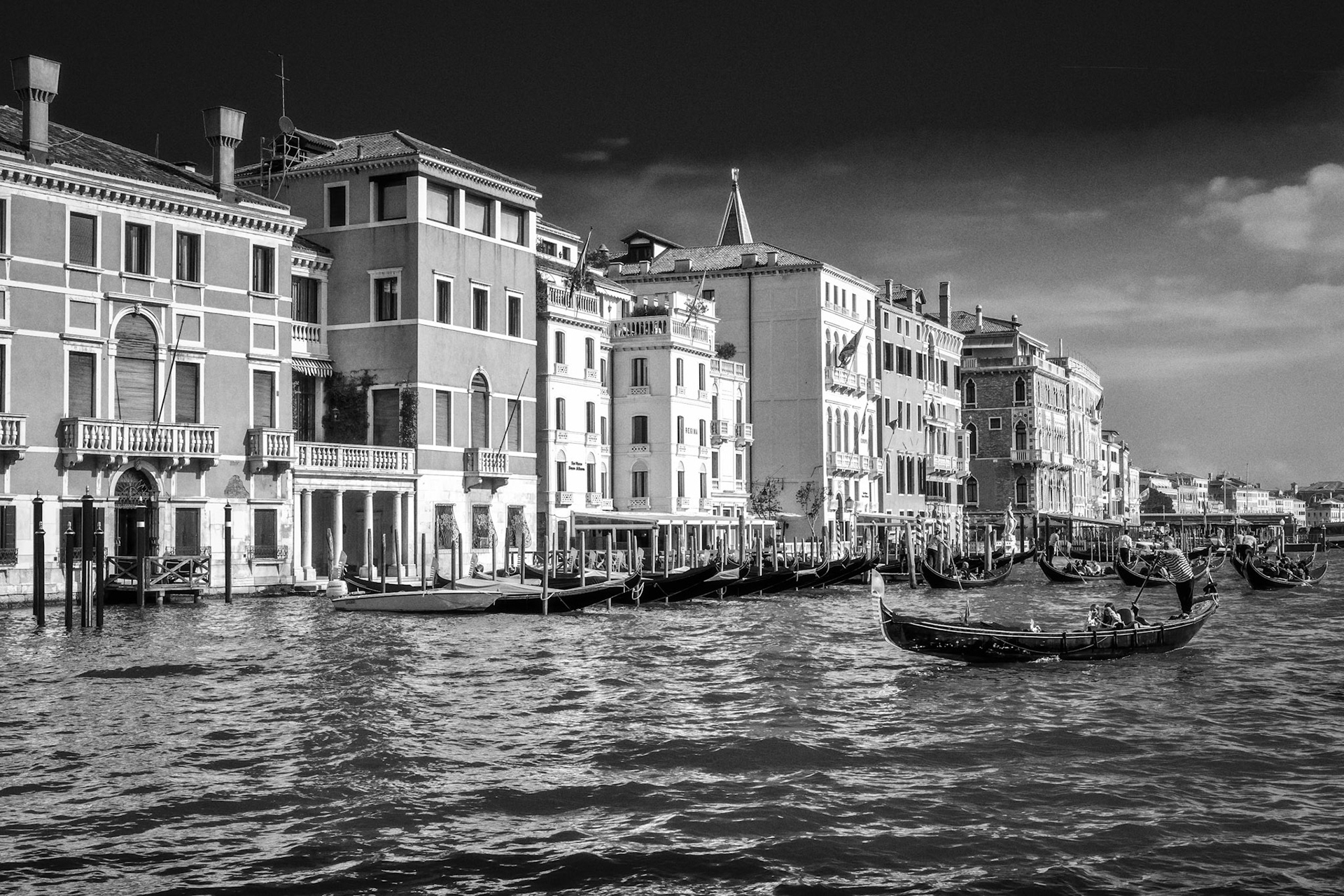Gondoliers Ferrying People in Venice