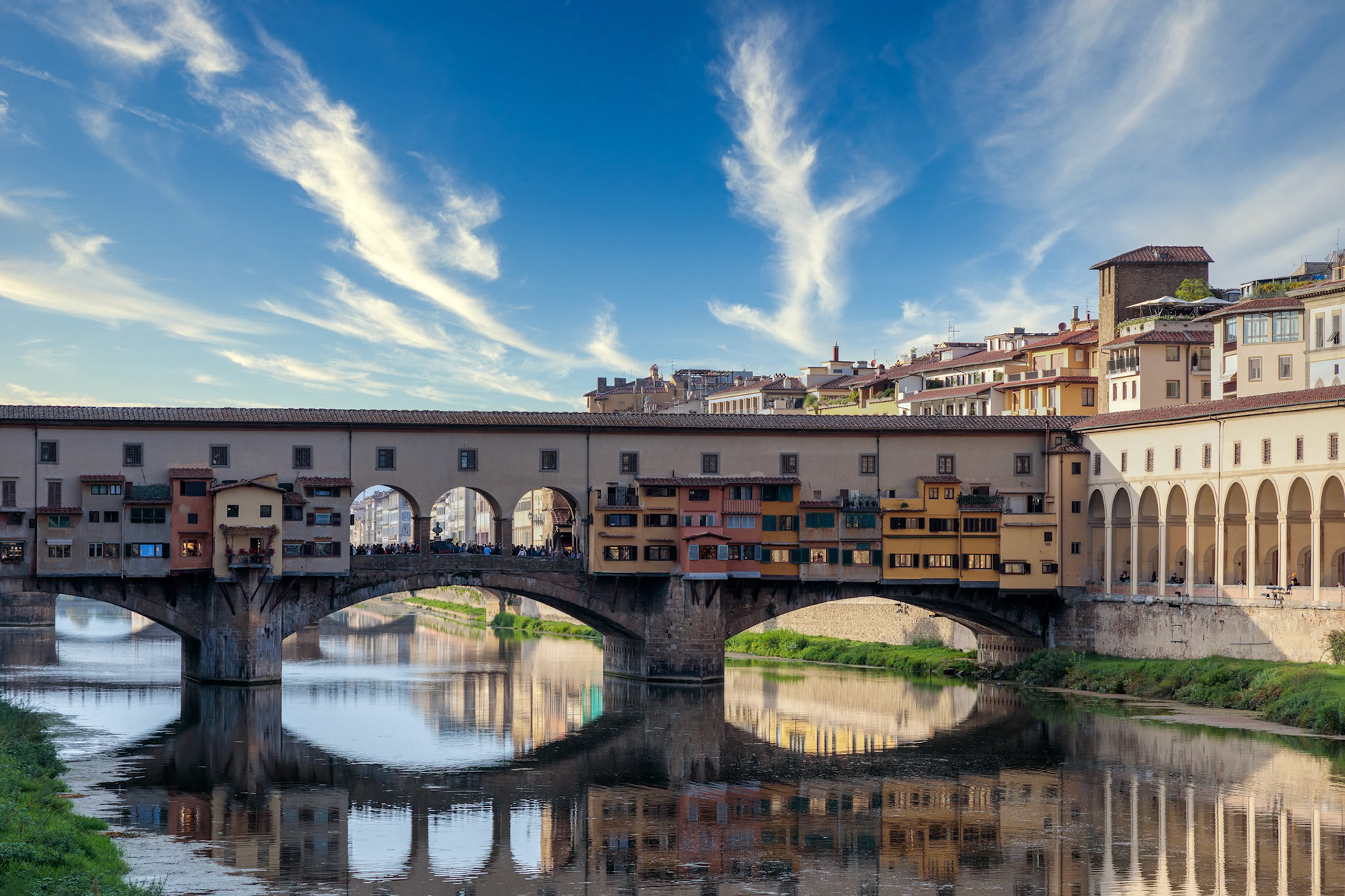 FLORENCE, TUSCANY/ITALY - OCTOBER 18 : View of buildings along and across the River Arno in Florence  on October 18, 2019. Unidentified people.
