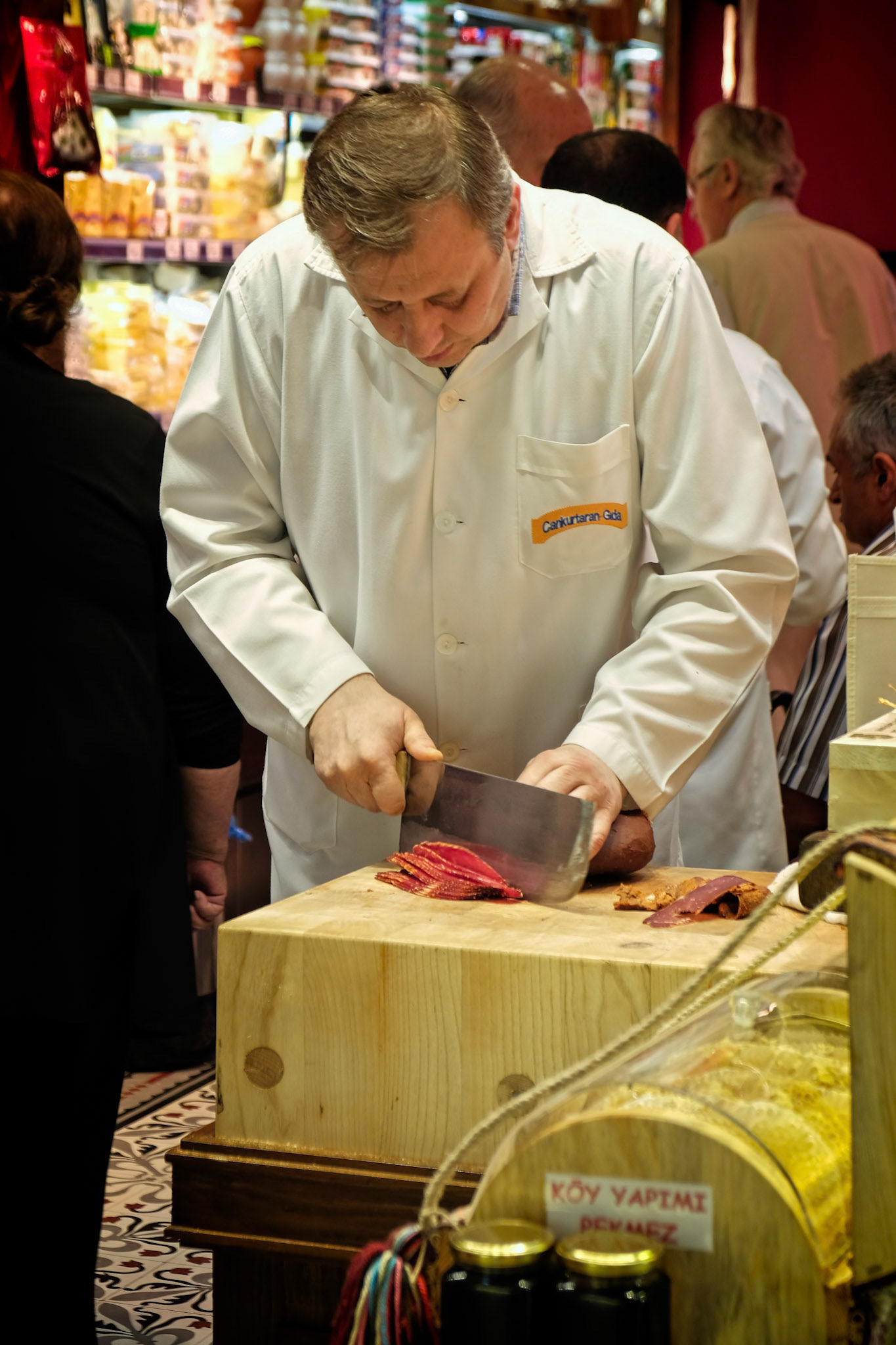 ISTANBUL, TURKEY - MAY 25 : Man slicing meat in the Spice Bazaar in Istanbul Turkey on May 25, 2018. Unidentified people