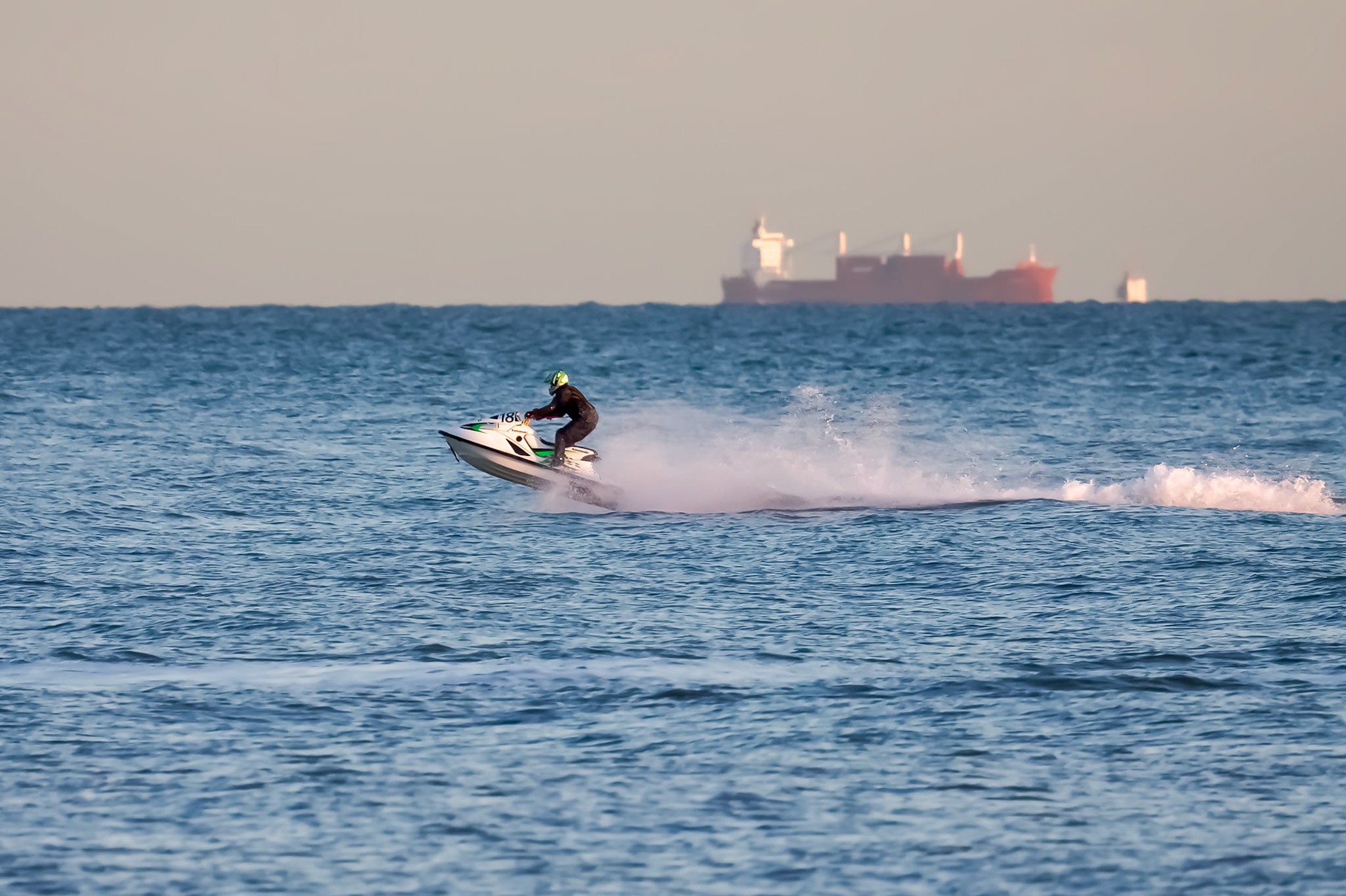 DUNGENESS, KENT/UK - DECEMBER 17 : Man riding a jet ski off Dungeness beach in Kent on December 17, 2008. One unidentified person