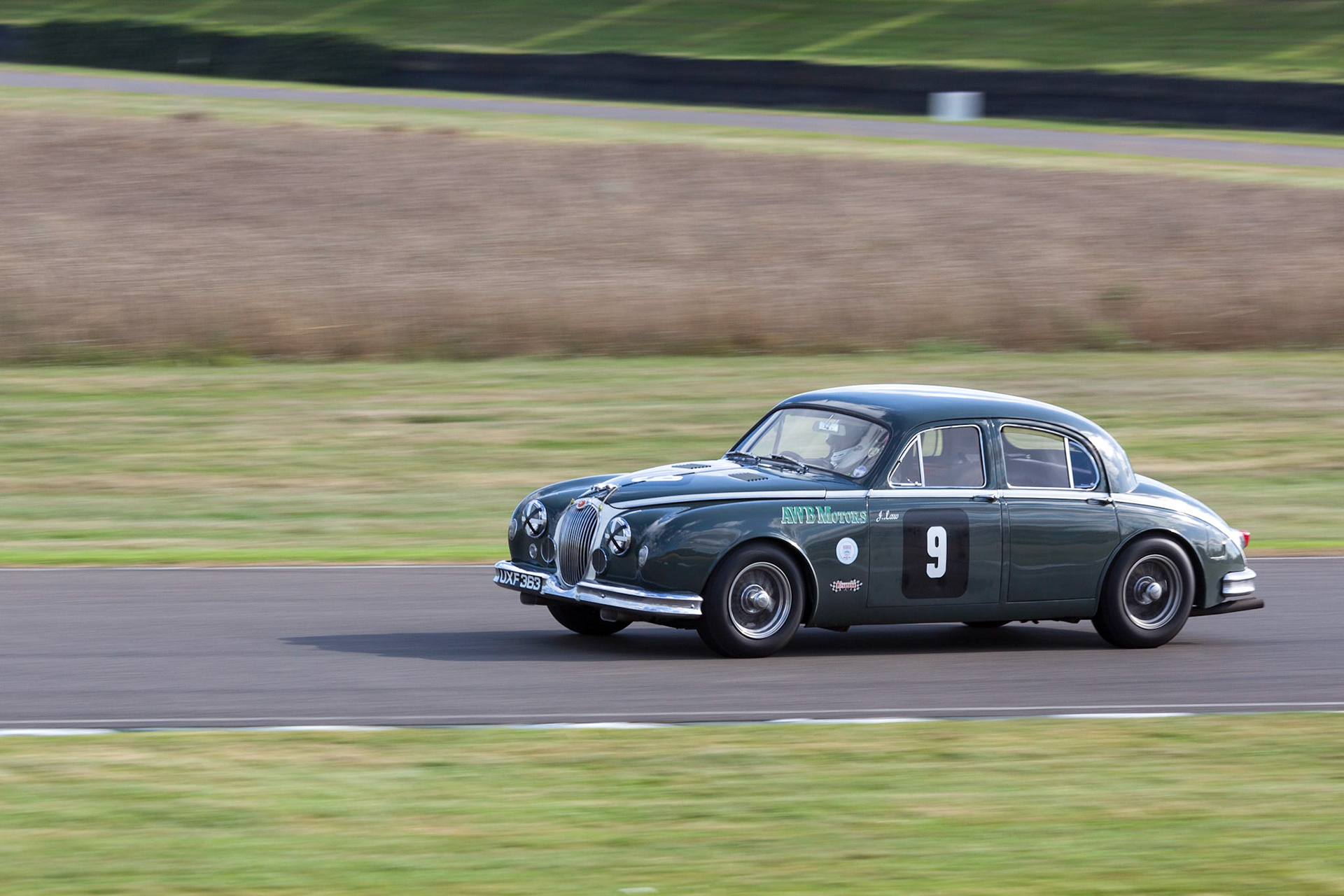 GOODWOOD, WEST SUSSEX/UK - SEPTEMBER 14 : Vintage Racing at Goodwood on September 14, 2012. One unidentified person