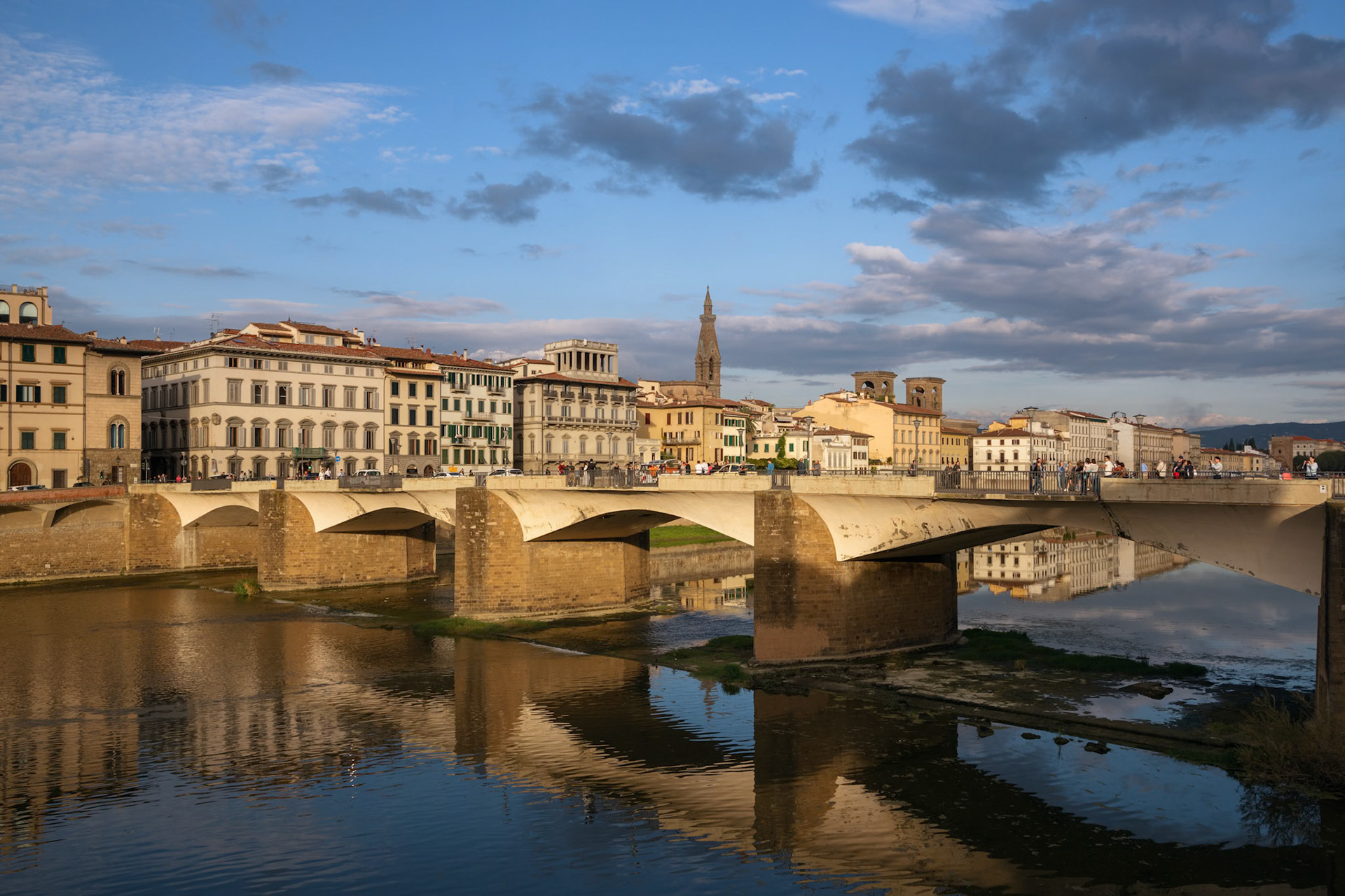 FLORENCE, TUSCANY/ITALY - OCTOBER 18 : View of buildings along and across the River Arno in Florence  on October 18, 2019. Unidentified people.
