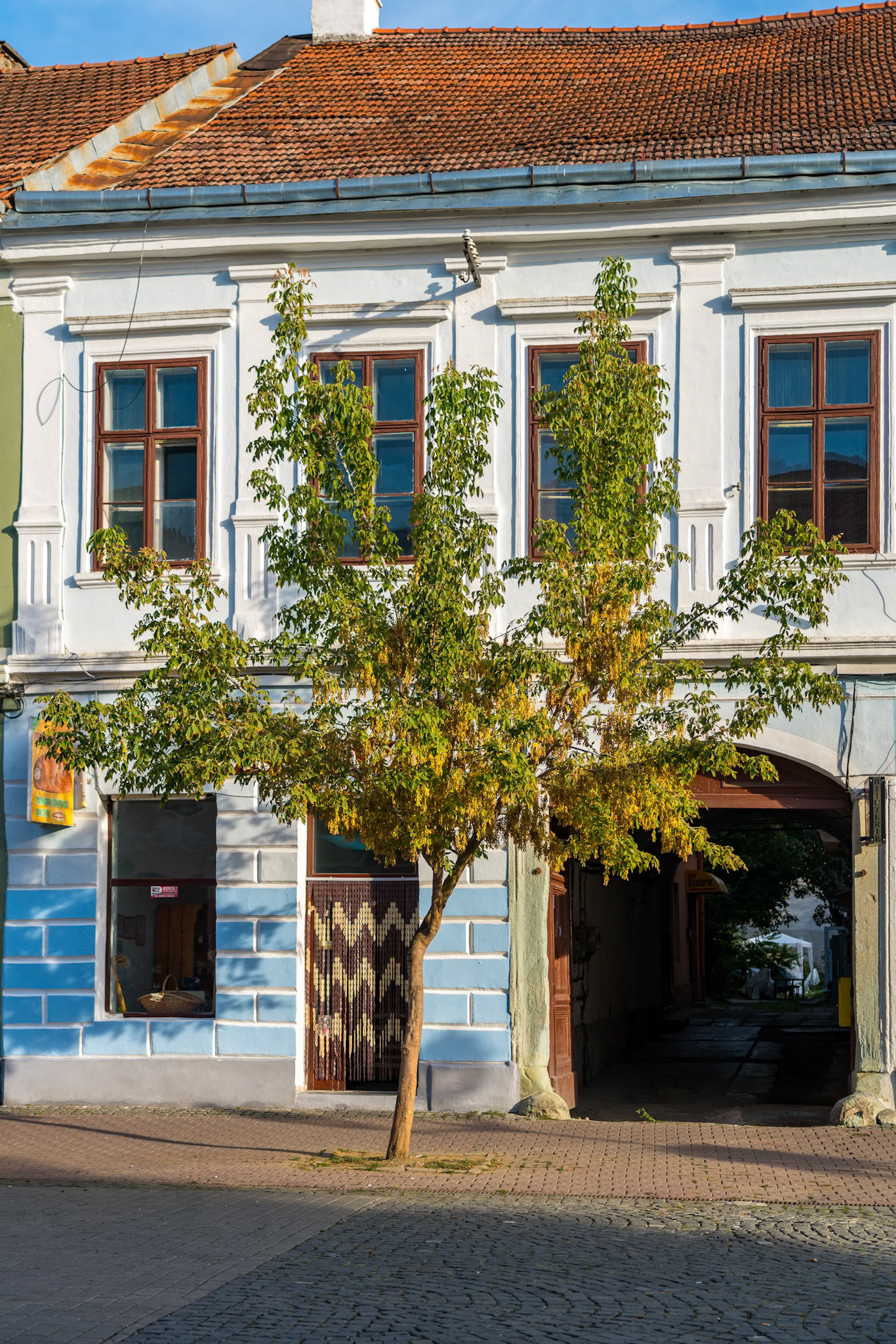 BISTRITA, TRANSYLVANIA/ROMANIA - SEPTEMBER 17 : Evening sunshine on a building in Bistrita Transylvania Romania on September 17, 2018