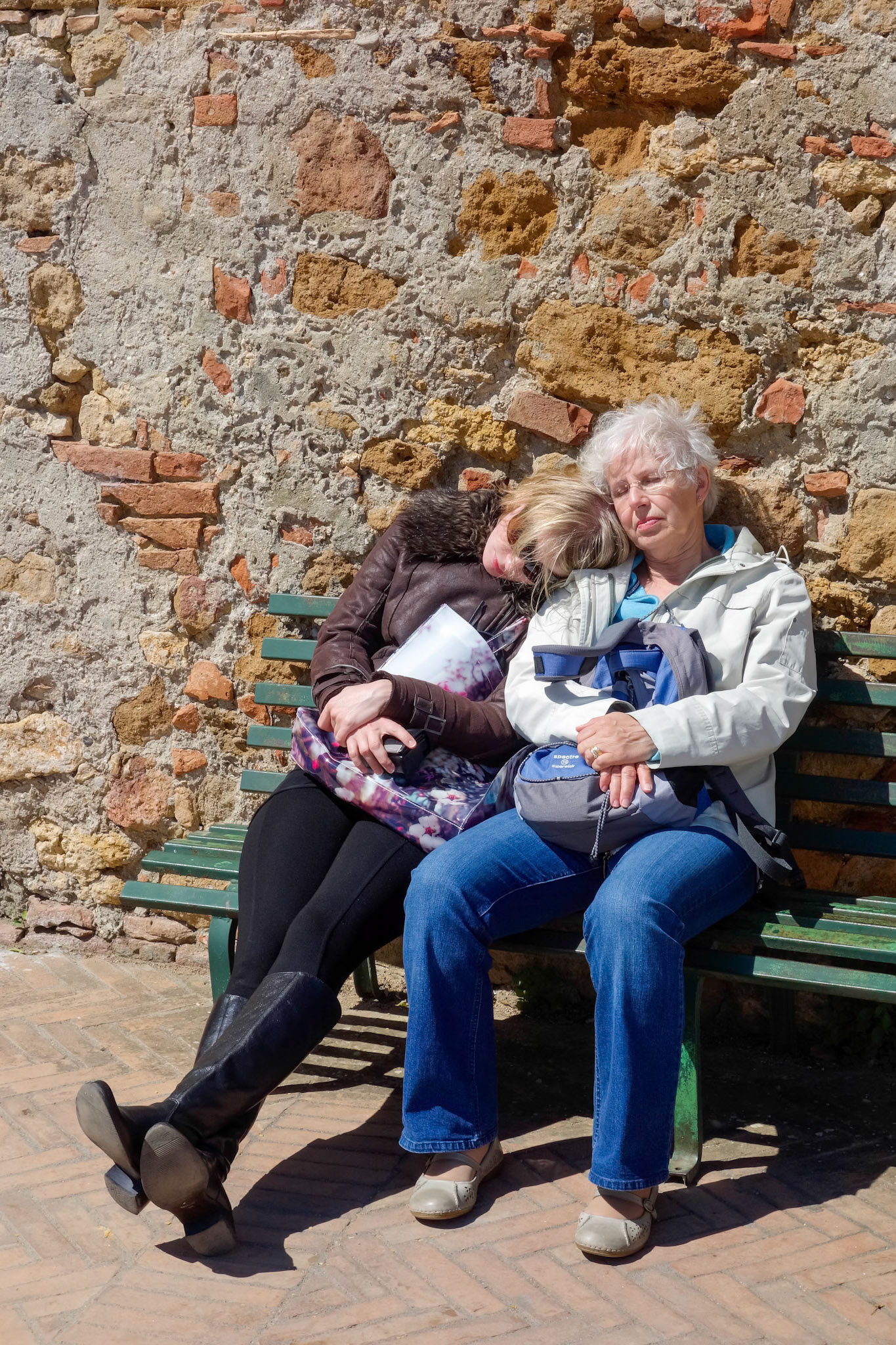PIENZA, TUSCANY/ITALY - MAY 19 : It's hard work being a tourist in Pienza Tuscany  on May 19, 2013. Two unidentified people