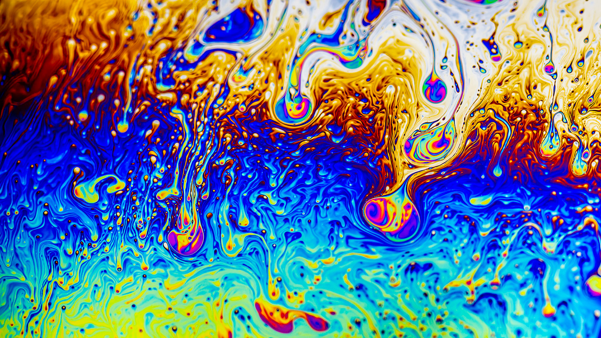 Extreme close-up of the colourful surface of a bubble