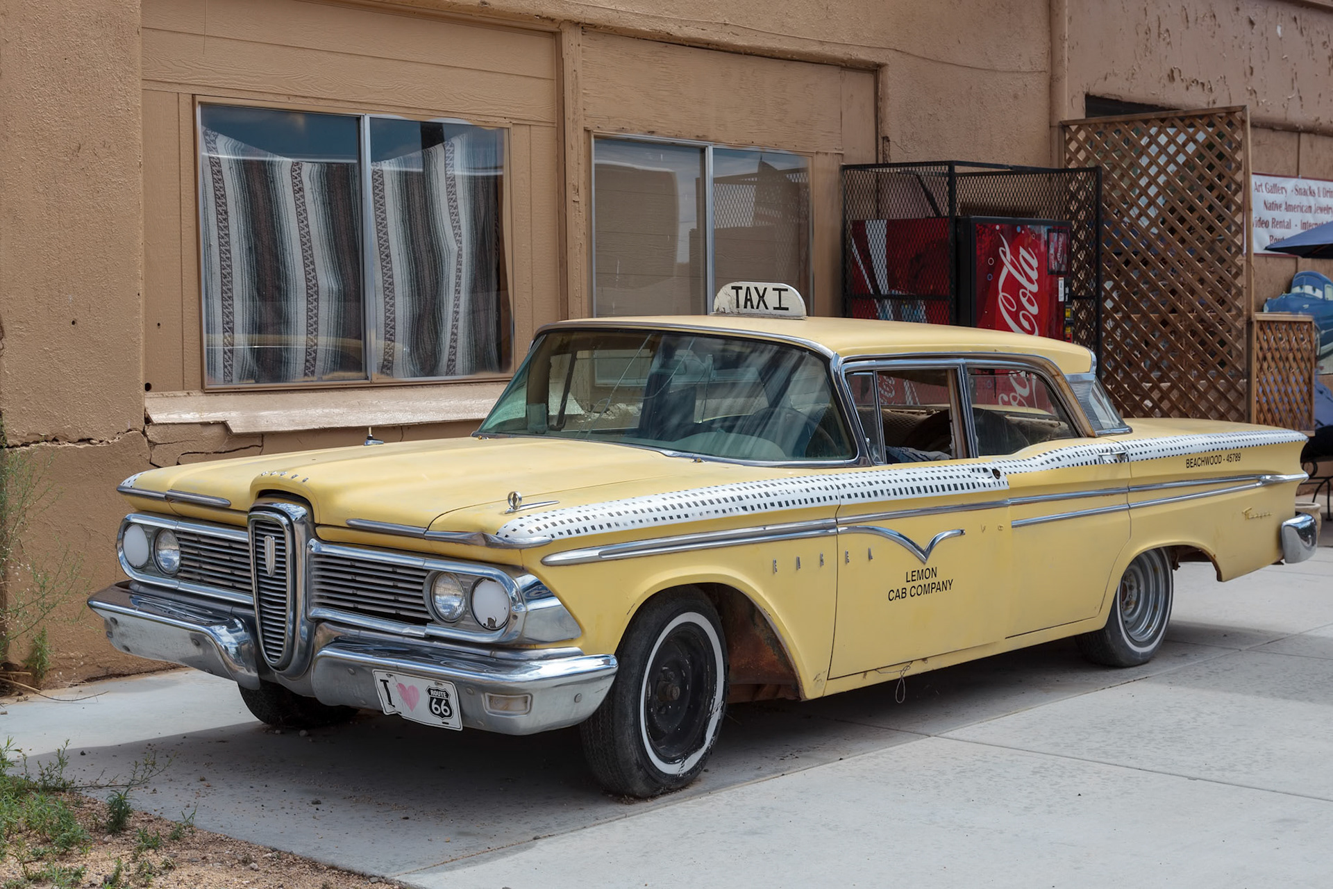 SELIGMAN, ARIZONA, USA - JULY 31 : Old Yellow taxi parked in Seligman Arizona on July 31, 2011. Unidentified man.