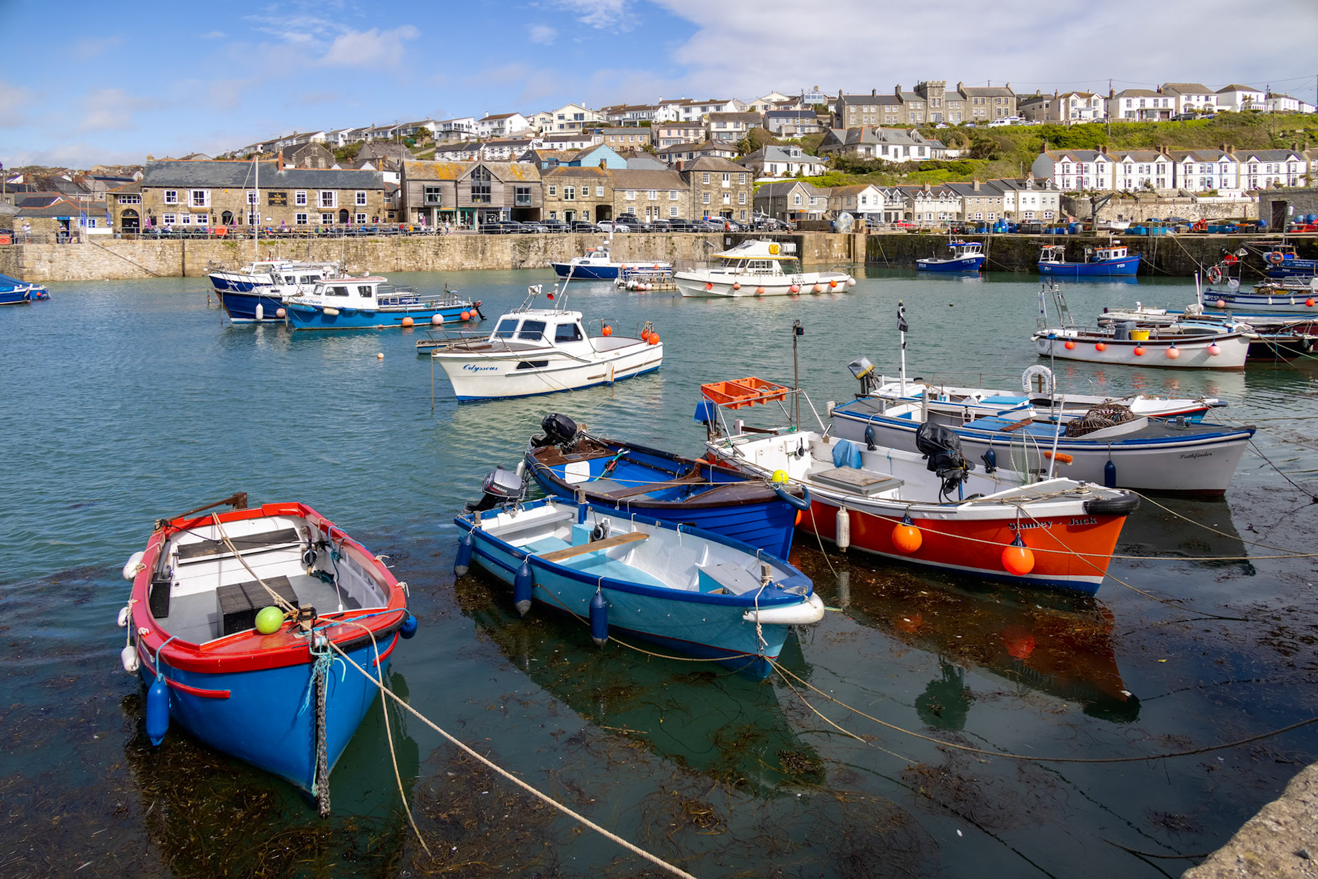 PORTHLEVEN, CORNWALL, UK - MAY 11 : View of the town and harbour in Porthleven, Cornwall on May 11, 2021. Unidentified people