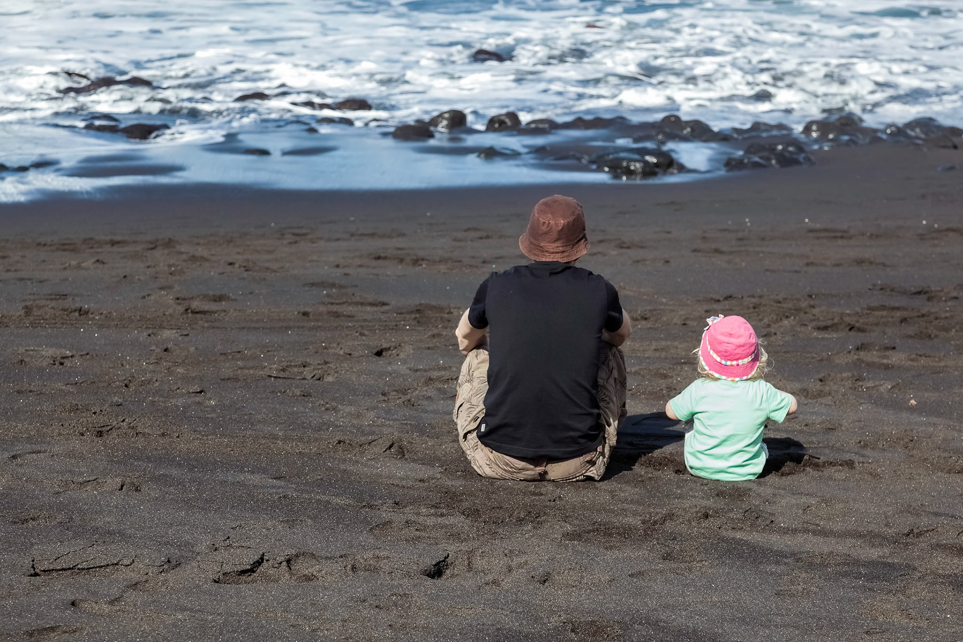 Dad and Daughter Watching the Waves