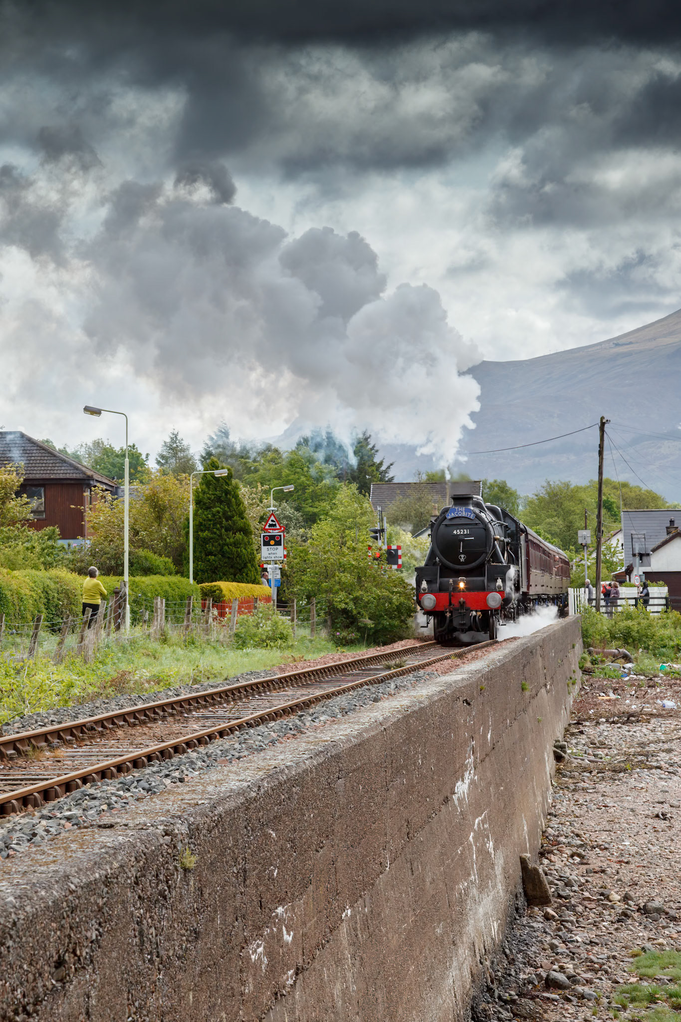 CORPACH, SCOTLAND, UK - MAY 19 : The Jacobite leaving the station at Corpach in Scotland on May 19, 2011. Unidentified people