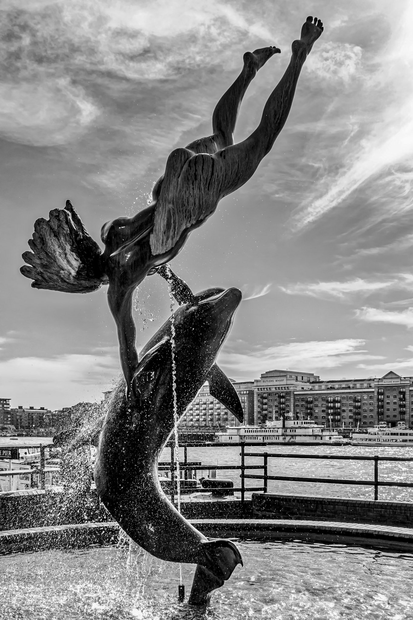 David Wayne Sculpture "Girl with the dolphin" next to Tower Bridge in London