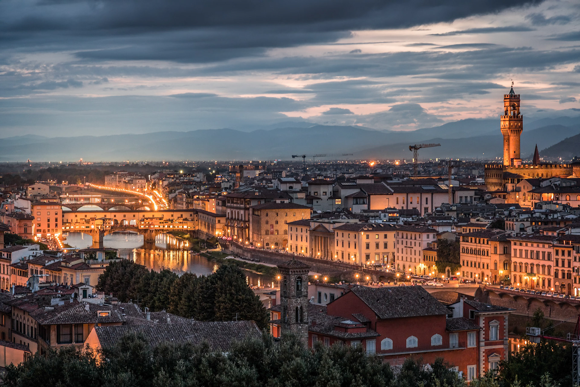 FLORENCE, TUSCANY/ITALY - OCTOBER 18 : Distant view of Palazzo Vecchio at dusk in Florence on October 18, 2019