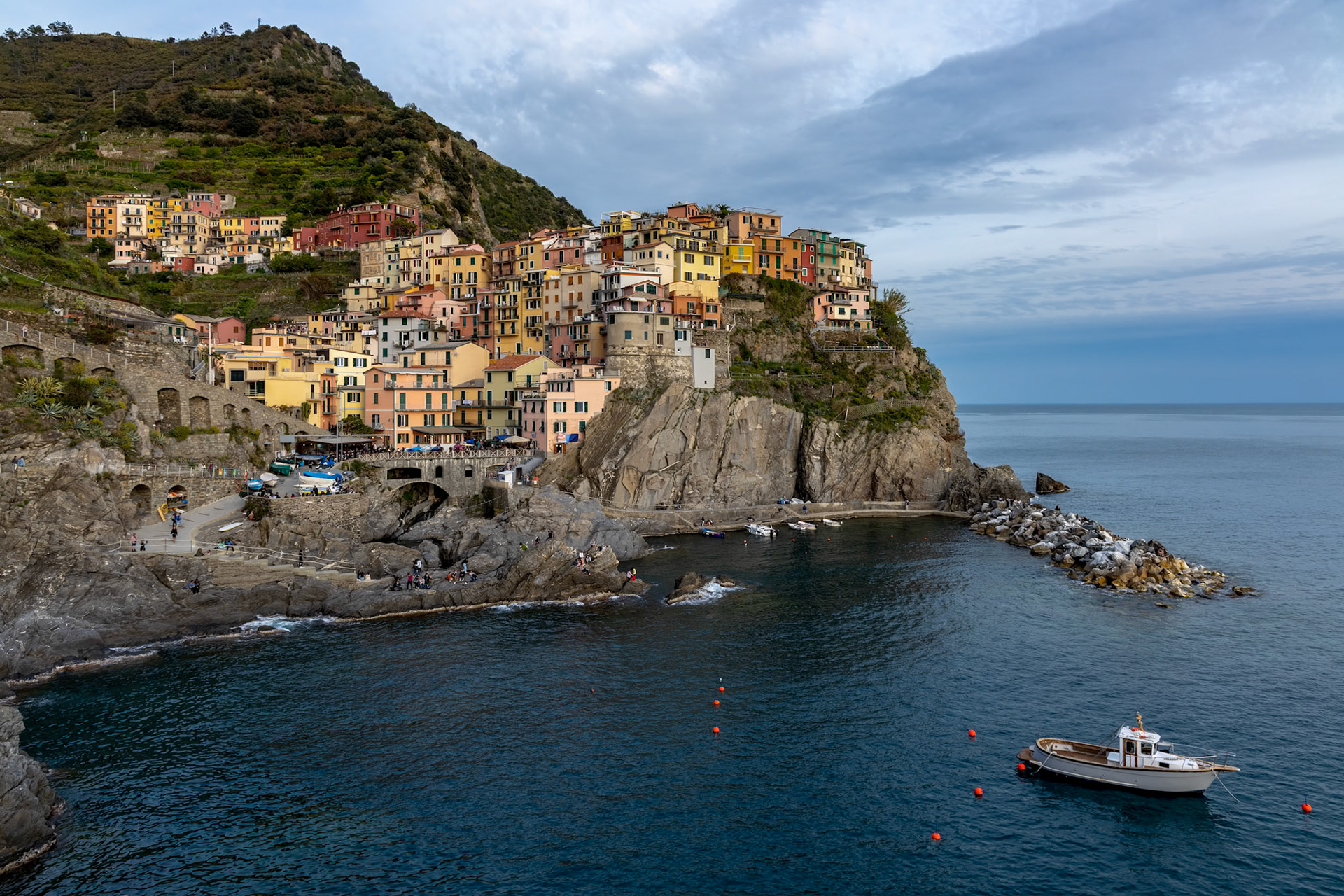 MANAROLA, LIGURIA/ITALY  - APRIL 21 : Coastal view at dusk of Manarola Liguria Italy on April 21, 2019. Unidentified people