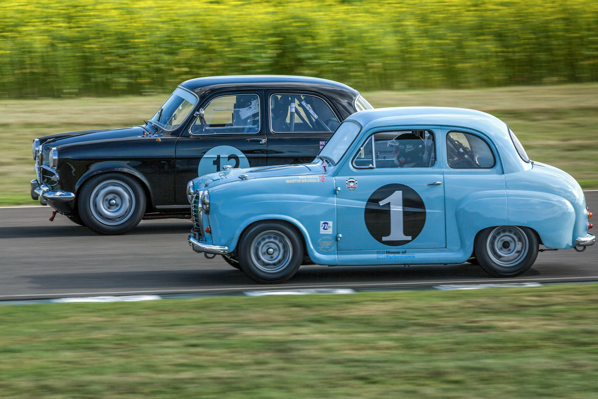 GOODWOOD, WEST SUSSEX/UK - SEPTEMBER 14 : Vintage Racing at Goodwood at Goodwood on September 14, 2012. Two unidentified people