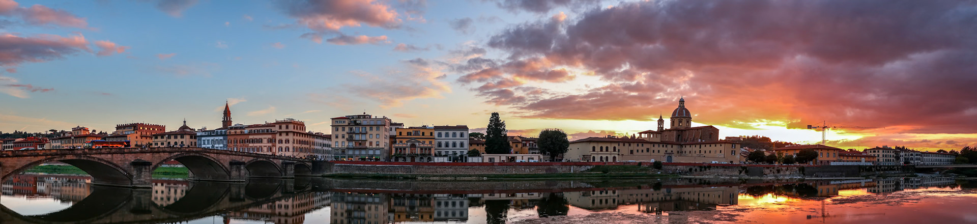 FLORENCE, TUSCANY/ITALY - OCTOBER 19 : View of buildings along the River Arno at dusk  in Florence  on October 19, 2019