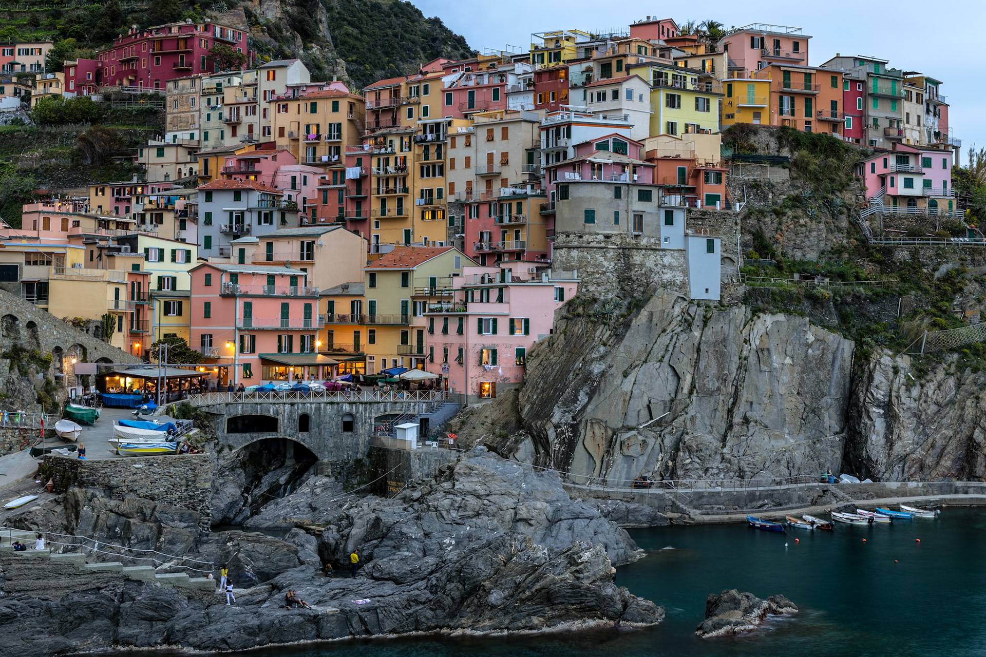 MANAROLA, LIGURIA/ITALY  - APRIL 20 : Coastal view at dusk of Manarola Liguria Italy on April 20, 2019. Unidentified people