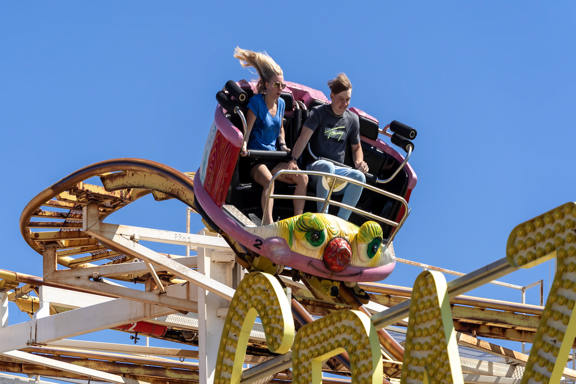 Brighton, East Sussex, UK - July 15, 2022 : View of the scenic railway ride on the pier  in Brighton on July 15, 2022. Two unidentified people