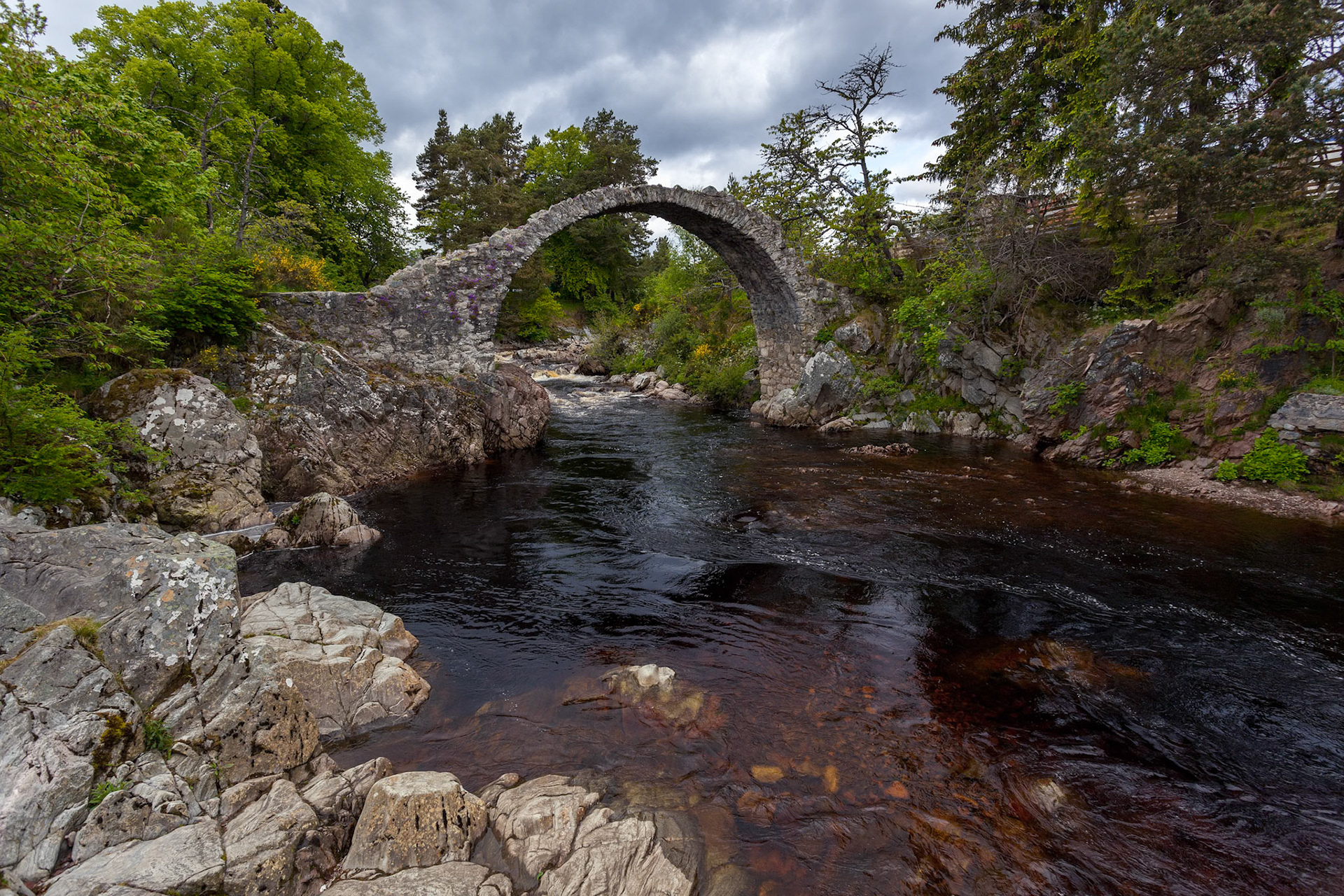 CARRBRIDGE, BADENOCH and STRATHSPEY/SCOTLAND - MAY 21 : Packhorse bridge at Carrbridge Scotland on May 21, 2011