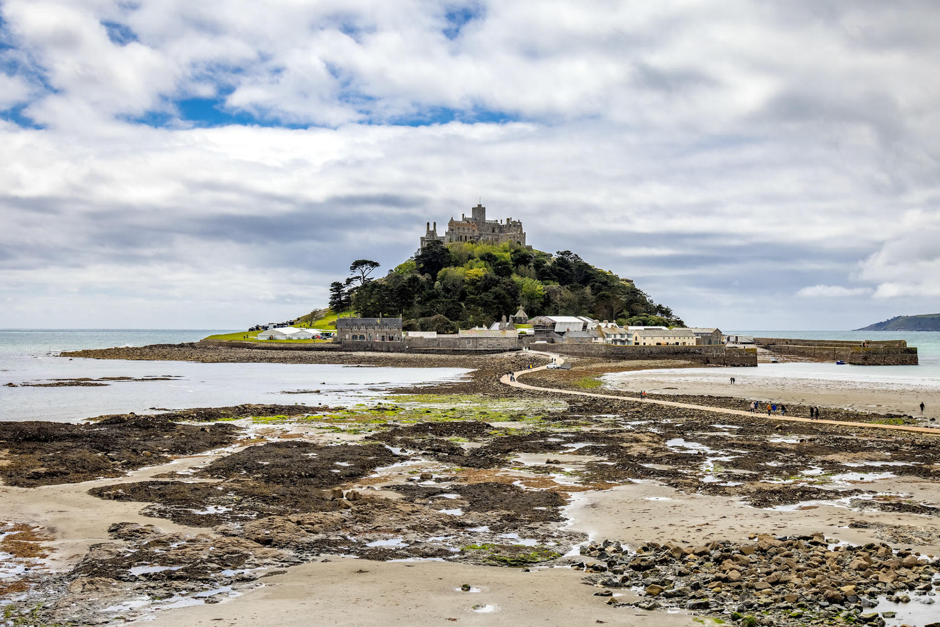 MARAZION, CORNWALL, UK - MAY 11 : View of St Michaels Mount near Marazion Cornwall on May 11, 2021. Unidentified people