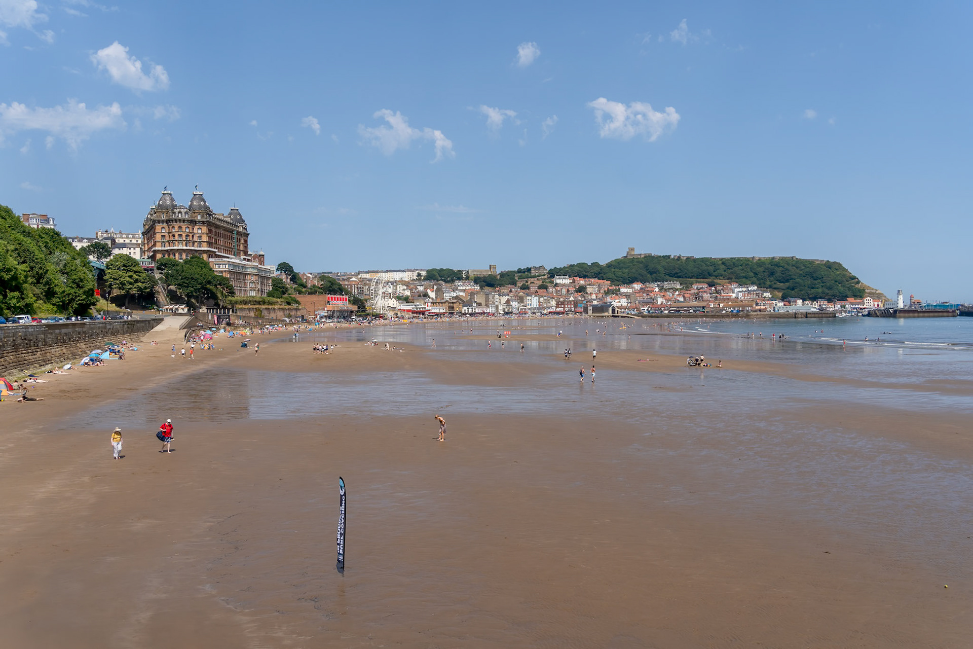 SCARBOROUGH,  NORTH YORKSHIRE, UK - JULY 18: View of the sea front in Scarborough, North Yorkshire on July 18, 2022. Unidentified people