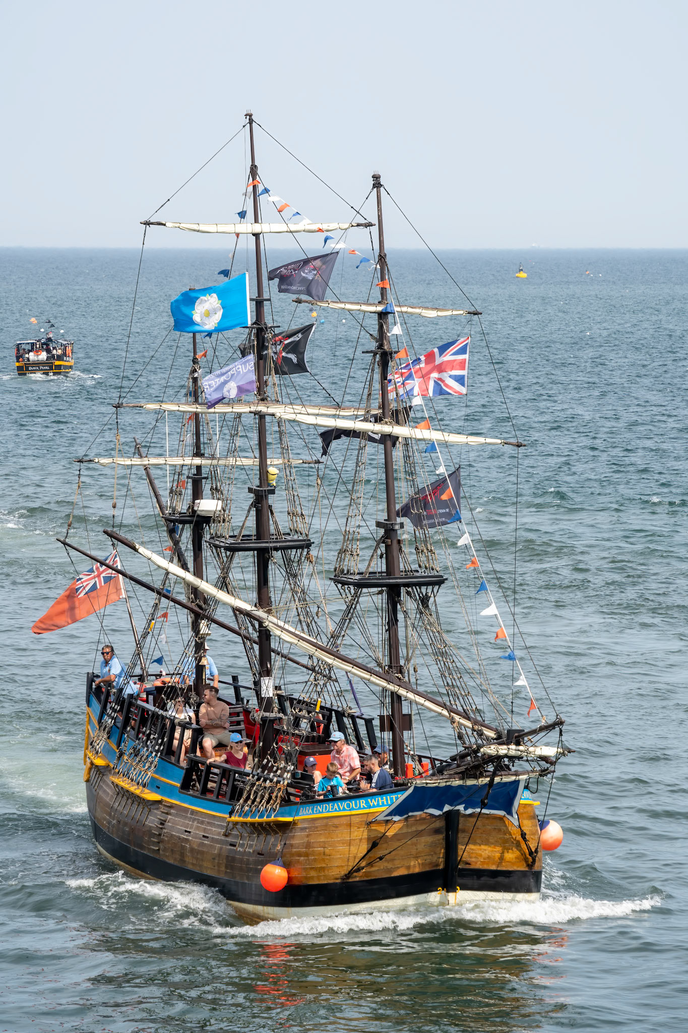 WHITBY,  NORTH YORKSHIRE, UK - JULY 19: Replica galleon pleasure boat heading into Whitby, North Yorkshire on July 19, 2022. Unidentified people