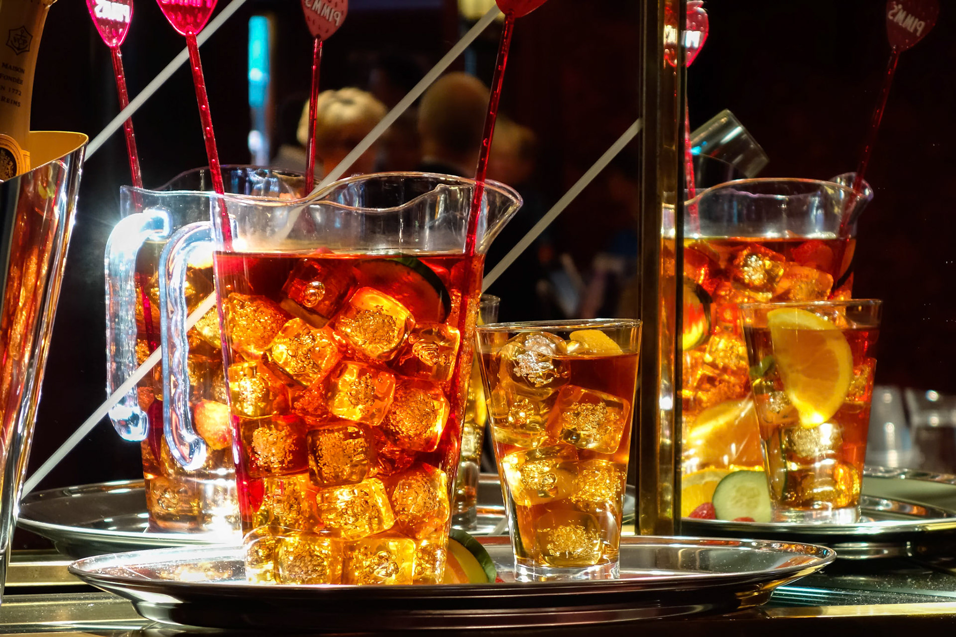LONDON - JULY 27 : Jugs of a fruity alcoholic drink awaiting collection in a theatre in London on July 27, 2013. Three unidentified people.