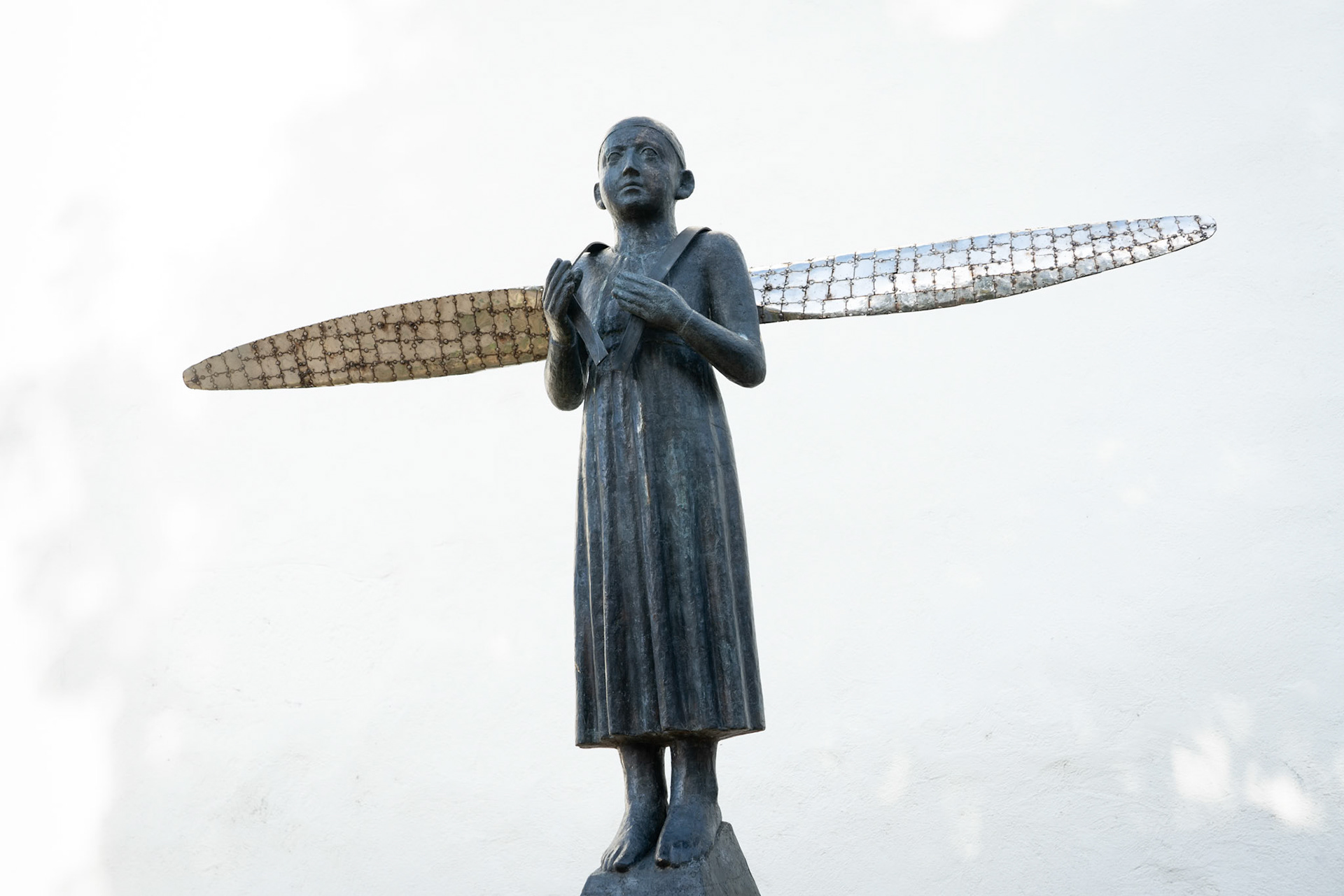 BISTRITA, TRANSYLVANIA/ROMANIA - SEPTEMBER 17 : Modern sculpture in front of the Lutheran Church in Bistrita Transylvania Romania on September 17, 2018