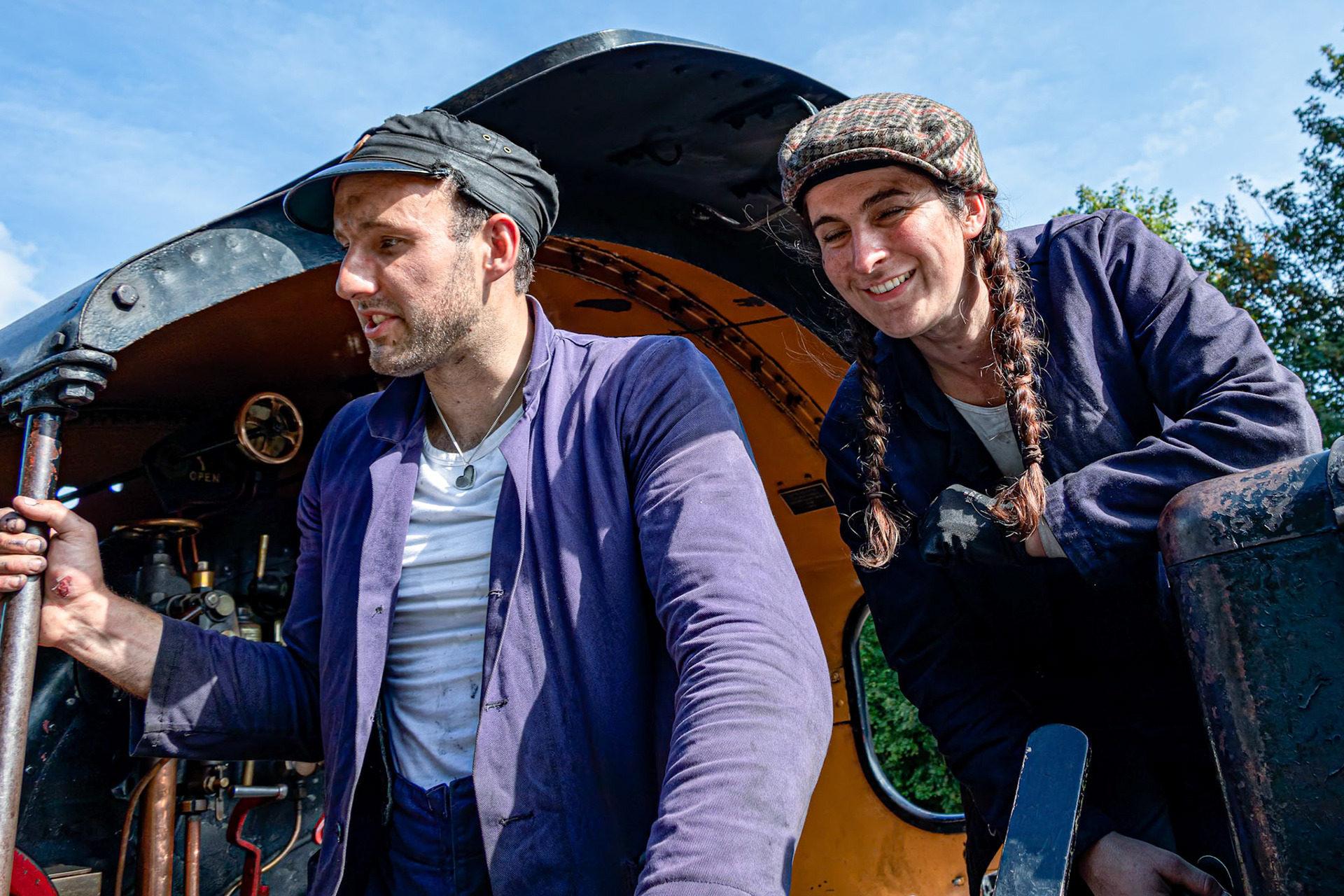 EAST GRINSTEAD, WEST SUSSEX/UK - AUGUST 30 : Fireman and stoker of steam locomotive in East Grinstead West Sussex on August 30, 2019. Two unidentified people