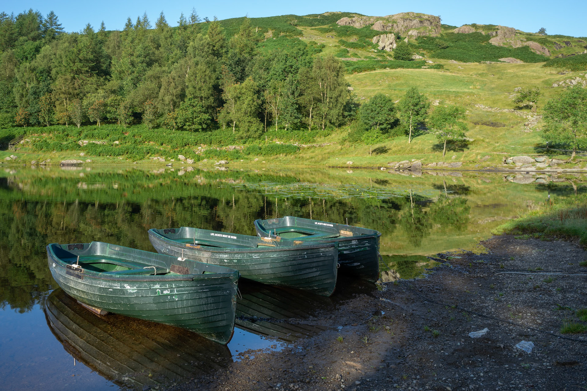 Rowing Boats Moored at Watendlath Tarn in the Lake District Cumbria