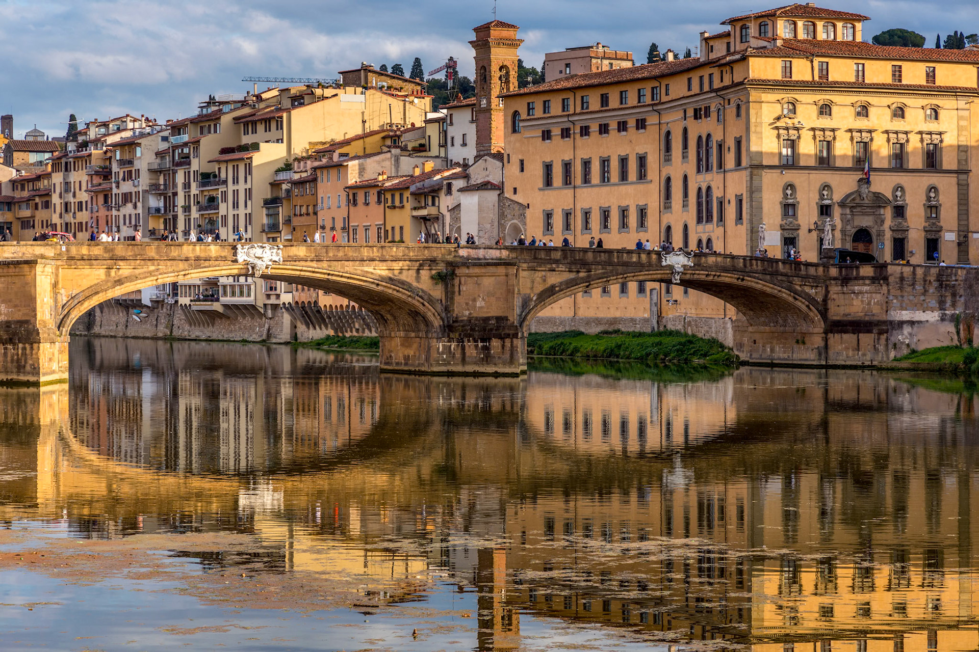 FLORENCE, TUSCANY/ITALY - OCTOBER 18 : View of buildings along and across the River Arno in Florence  on October 18, 2019. Unidentified people.