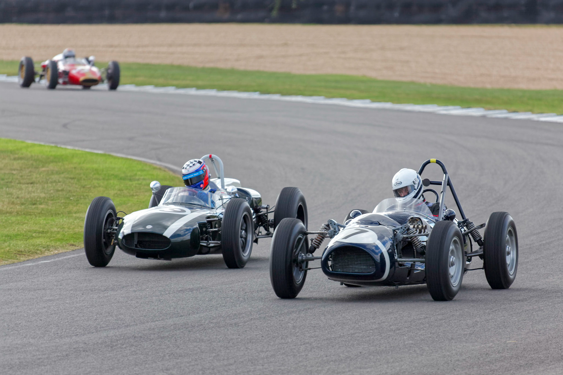 GOODWOOD, WEST SUSSEX/UK - SEPTEMBER 14 : Vintage Racing at Goodwood on September 14, 2012. Three unidentified people