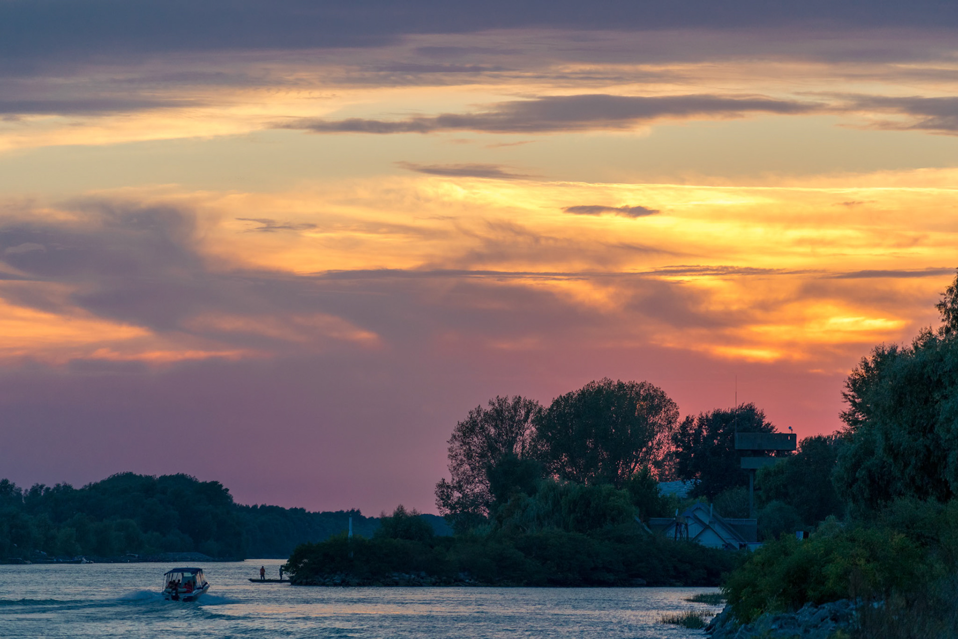 TULCEA, DANUBE DELTA/ROMANIA - SEPTEMBER 22 : High speed tourist boat ferrying people from Tulcea Danube Delta Romania on September 22, 2018. Unidentified people