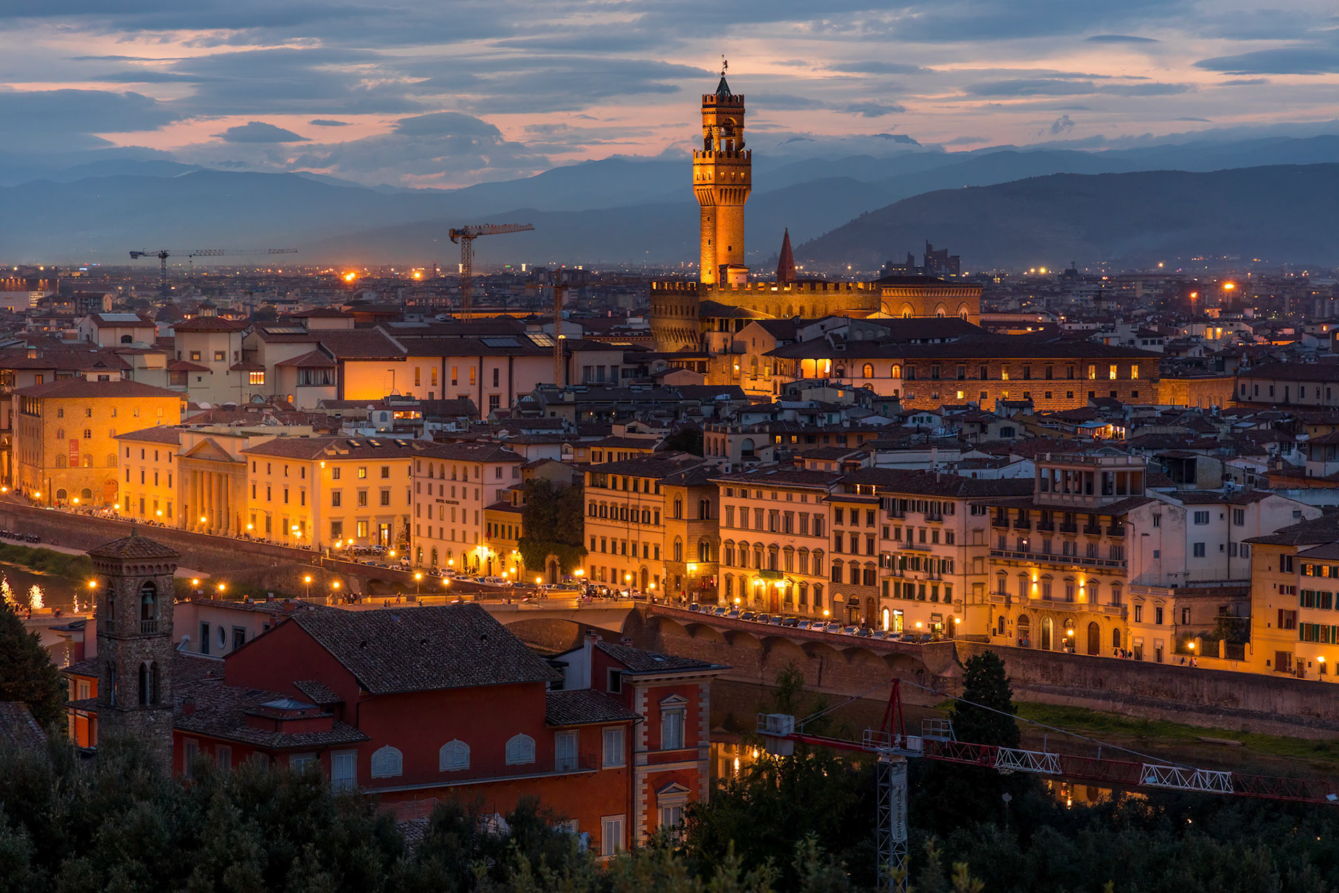 FLORENCE, TUSCANY/ITALY - OCTOBER 18 : Distant view of Palazzo Vecchio at dusk in Florence on October 18, 2019