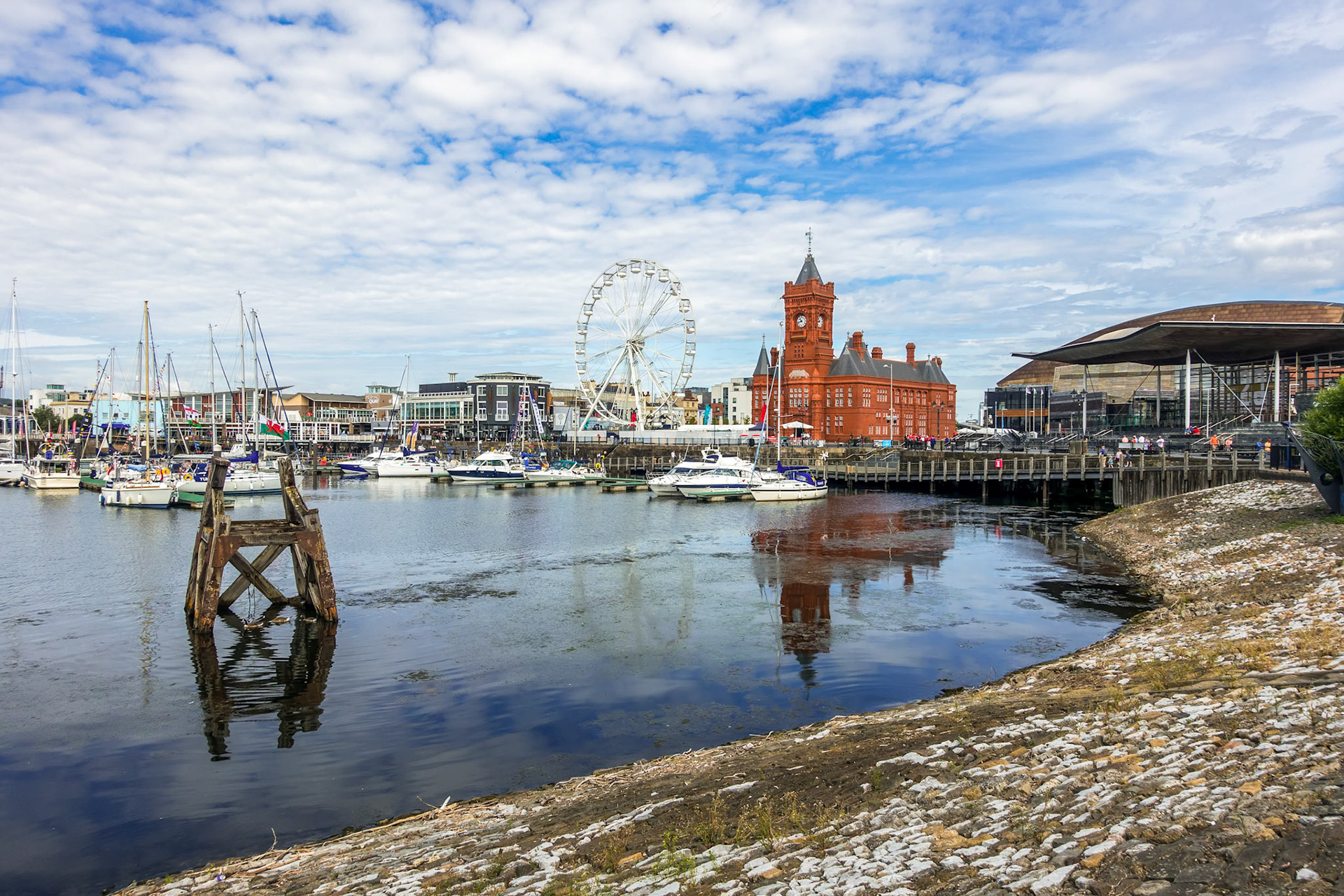 CARDIFF/UK - JULY 7 : View of Cardiff Bay and the Pierhead Building in Cardiff on July 7, 2019. Unidentified people