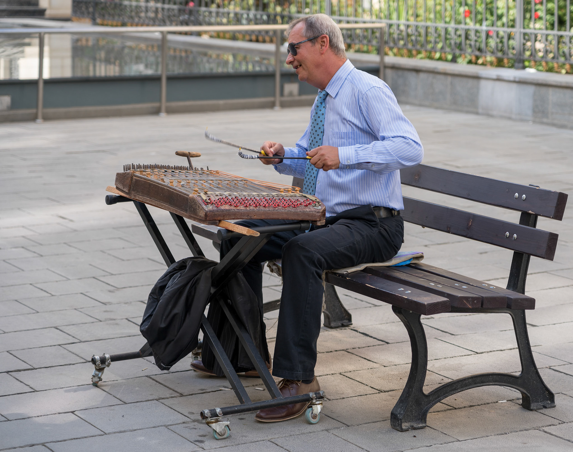 BUCHAREST/ROMANIA - SEPTEMBER 21 : Man playing an old  musical instrument in Bucharest Romania on September 21, 2018. One unidentified man