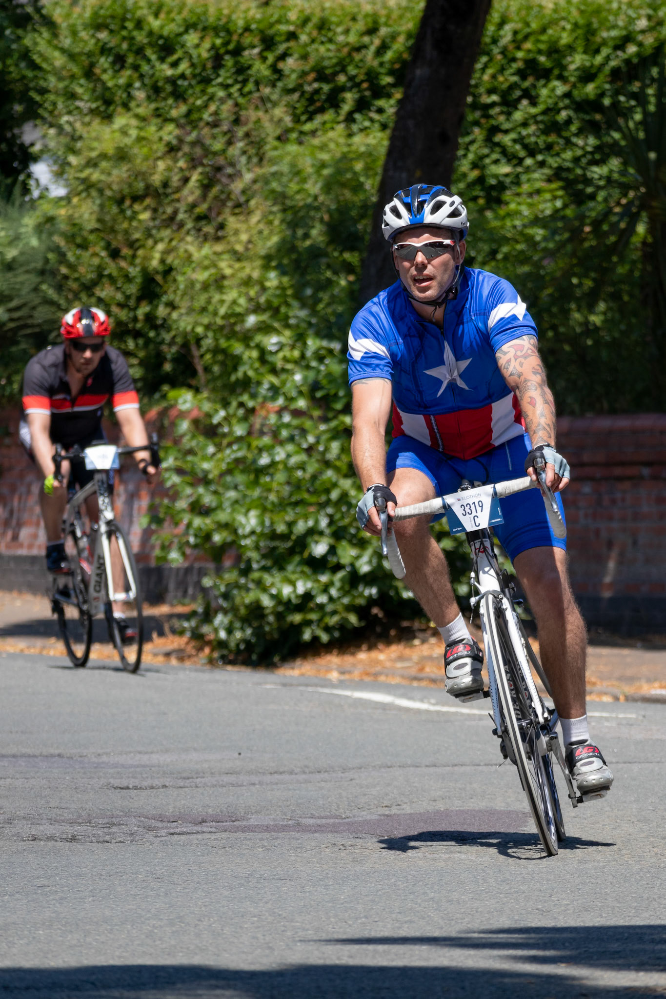 CARDIFF, WALES/UK - JULY 8 : Cyclists participating in the Velothon Cycling Event in Cardiff Wales on July 8, 2018. Two unidentified people