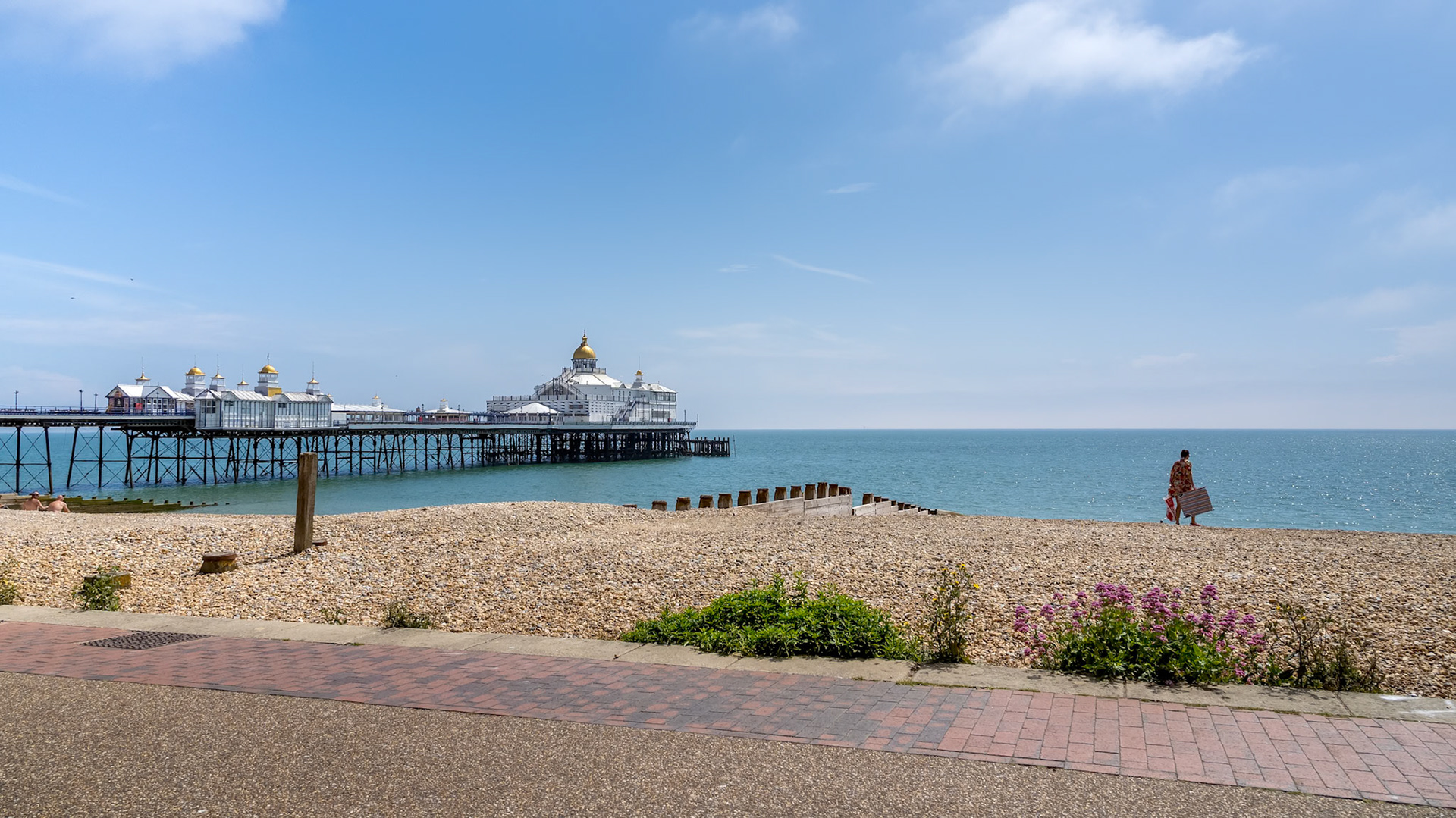 EASTBOURNE, EAST SUSSEX/UK - JUNE 16 : View of Eastbourne Pier in East Sussex on June 16, 2020. One unidentified woman