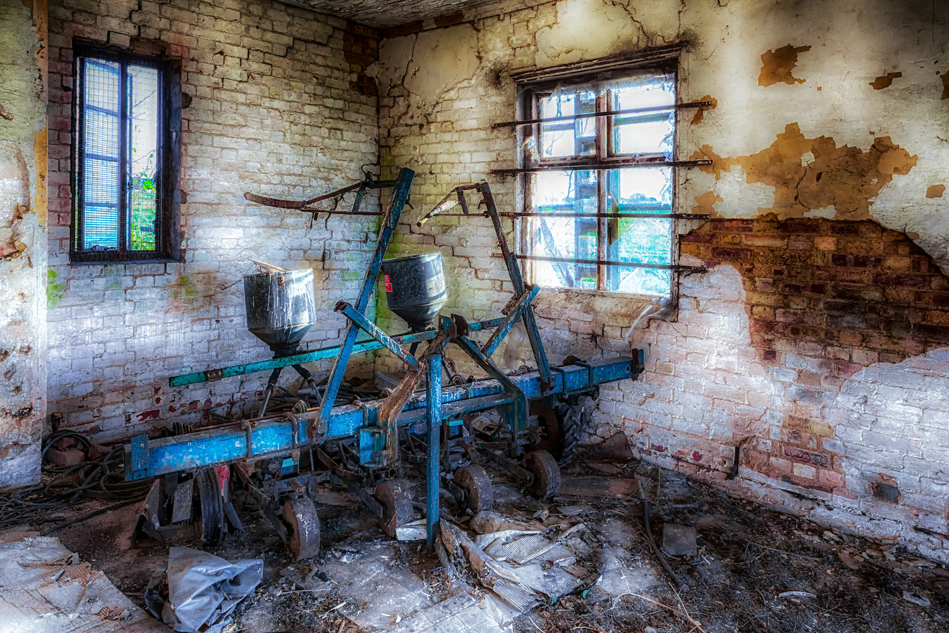CAMBRIDGESHIRE, UK - NOVEMBER 23 : Old piece of abandoned farming equipment in a derelict building in Cambridgeshire on November 23, 2012