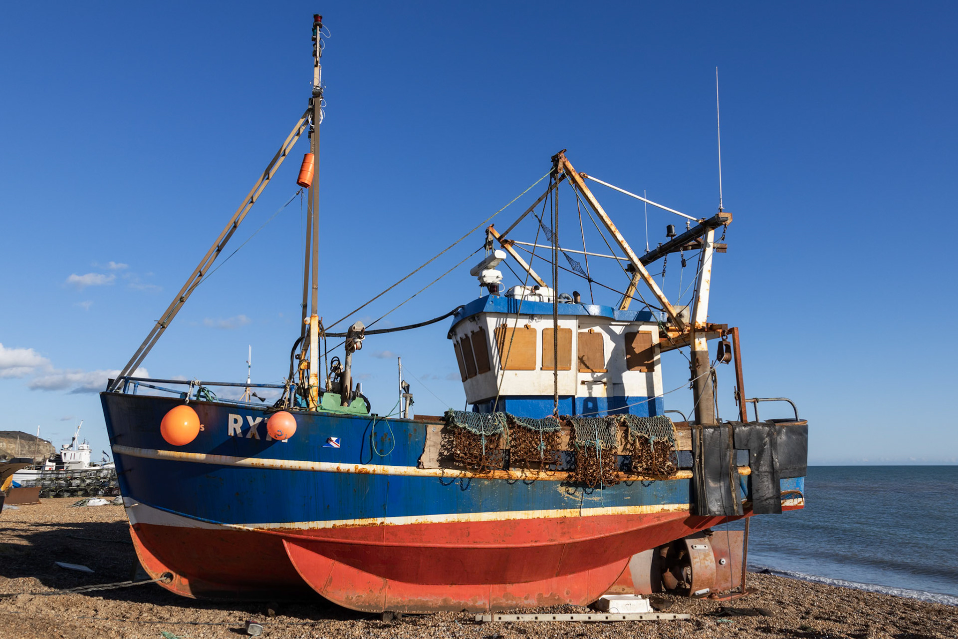 Hastings, East Sussex, UK - February 12. View of a fishing boat on the beach at Hastings, East Sussex on February 12, 2024