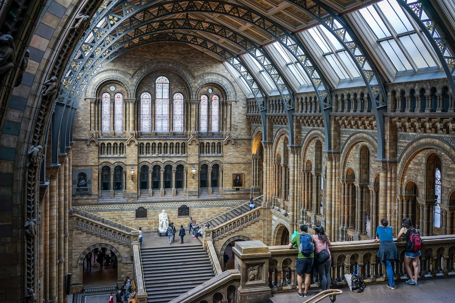 People Looking over a Balcony at the Natural History Museum in London