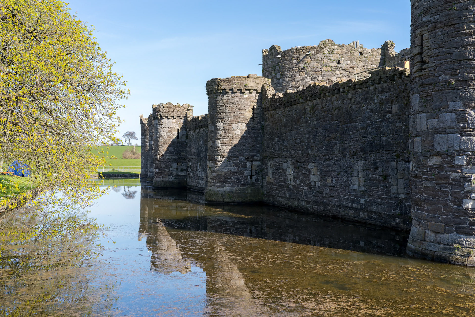 BEAUMARIS, ANGELSEY, UK - APRIL 08 : View of the ruins of the Castle in Beaumaris, Angelsey on April 08, 2023